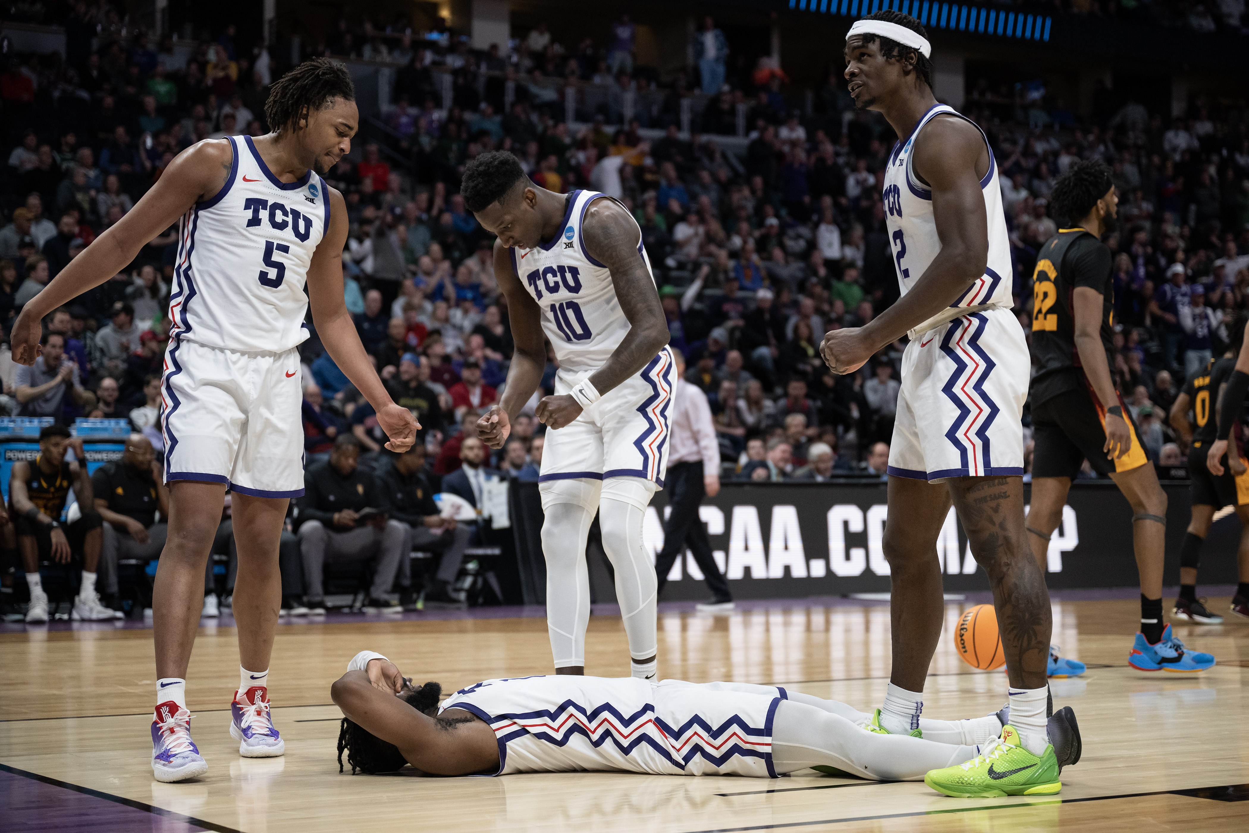 TCU Horned Frogs guard Mike Miles Jr. (1) lays on the court as his team trails the Arizona State Sun Devils in the second half of a first-round college basketball game in the NCAA Tournament on Friday, March 17, 2023, at Ball Arena in Denver, Colo. (Timothy Hurst/Denver Gazette) (Timothy Hurst/Denver Gazette)