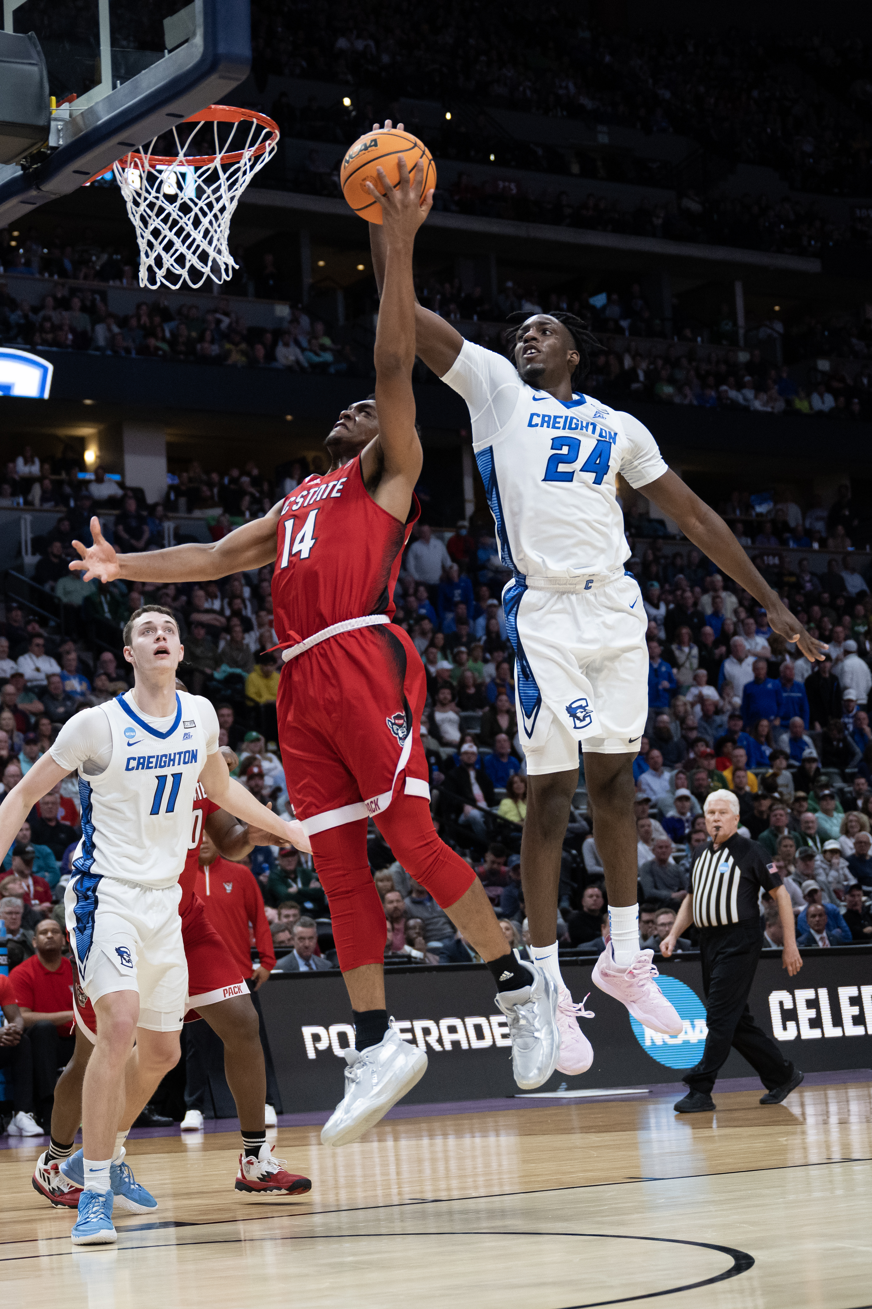 Creighton Bluejays forward Arthur Kaluma (24) blocks a shot by North Carolina State Wolfpack guard Casey Morsell (14) during a first-round college basketball game in the NCAA Tournament on Friday, March 17, 2023, at Ball Arena in Denver, Colo. (Timothy Hurst/Denver Gazette) (TimHursttim.hurst@gazette.comhttps://secure.gravatar.com/avatar/aca82bd62b4ee425c598527cd6faa1b1?d=mm&r=g)
