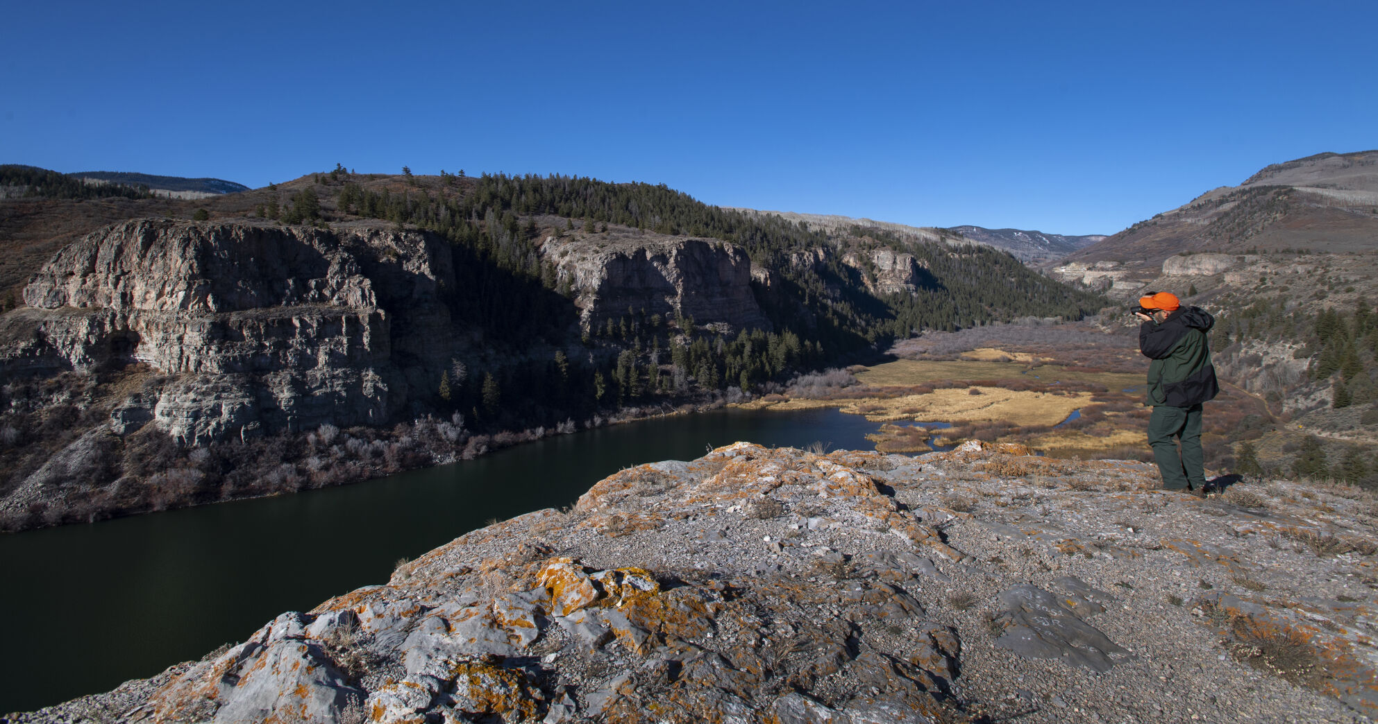 U.S. Forest Service’s David Boyd takes a picture of Sweetwater Lake in November 2021. (Christian Murdock/The Gazette)