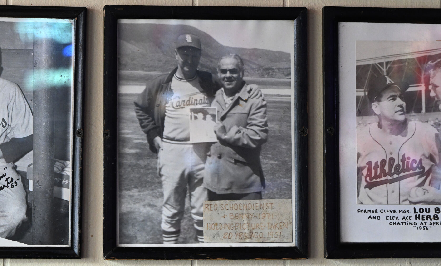 Benny Raviotti (right) poses with legendary St. Louis Cardinals’ coach Red Schoendienst in 1971. This is one of the many historical sports photos lining the wall of Benny’s Restaurant & Lounge. (Photo by Jerilee Bennett, The Gazette)