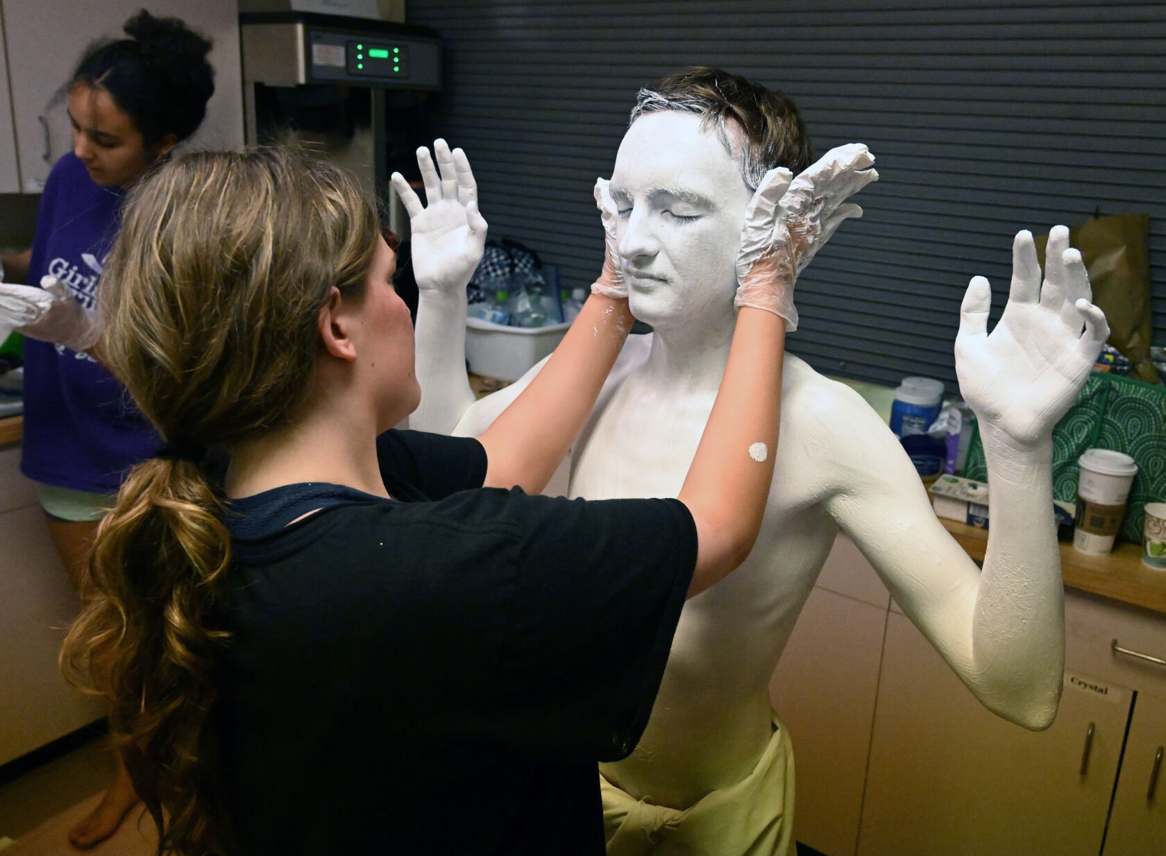 Conner Holiday was being transformed into a statue in which he would be depicting Jesus in Michelangelo’s