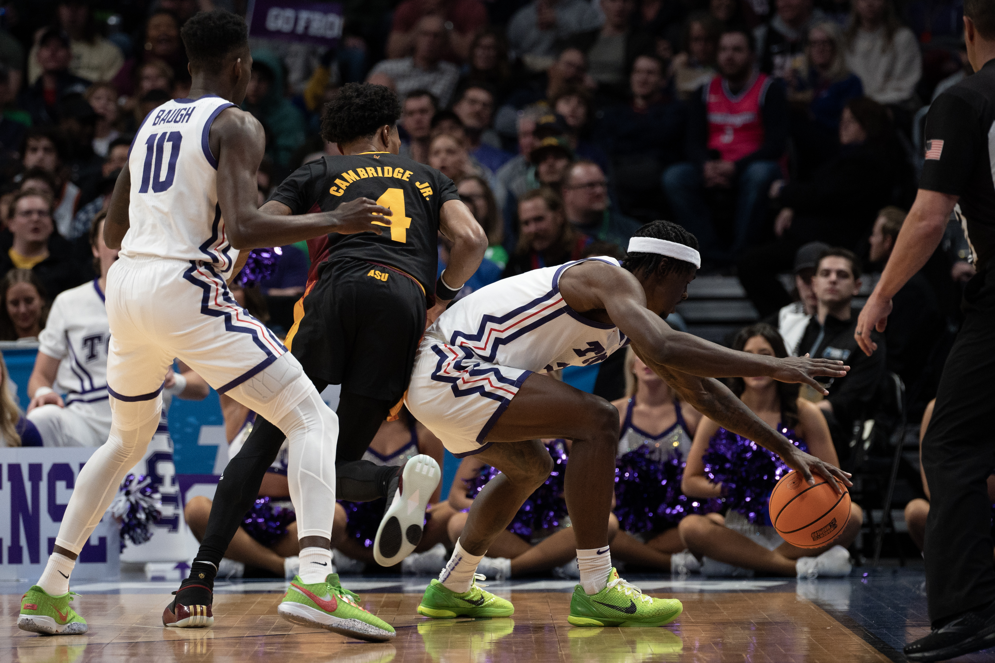 TCU Horned Frogs forward Emanuel Miller (2) keeps the ball inbounds after stealing it from Arizona State Sun Devils guard Desmond Cambridge Jr. (4) during a first-round college basketball game in the NCAA Tournament on Friday, March 17, 2023, at Ball Arena in Denver, Colo. (Timothy Hurst/Denver Gazette) (TimHursttim.hurst@gazette.comhttps://secure.gravatar.com/avatar/aca82bd62b4ee425c598527cd6faa1b1?d=mm&r=g)