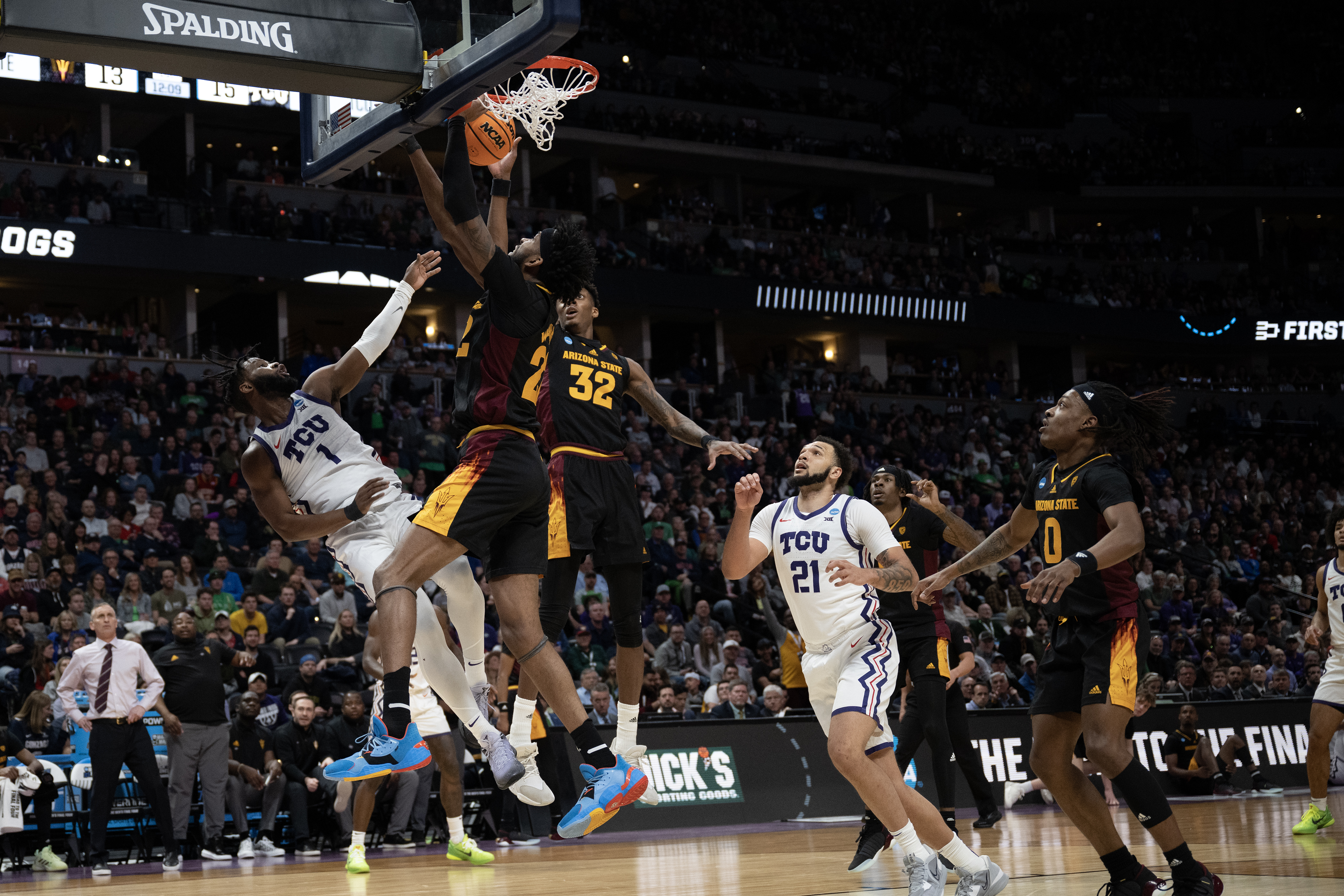 TCU Horned Frogs guard Mike Miles Jr. (1) draws a foul while going up against Arizona State University defenders during a first-round college basketball game in the NCAA Tournament on Friday, March 17, 2023, at Ball Arena in Denver, Colo. (Timothy Hurst/Denver Gazette) (TimHursttim.hurst@gazette.comhttps://secure.gravatar.com/avatar/aca82bd62b4ee425c598527cd6faa1b1?d=mm&r=g)