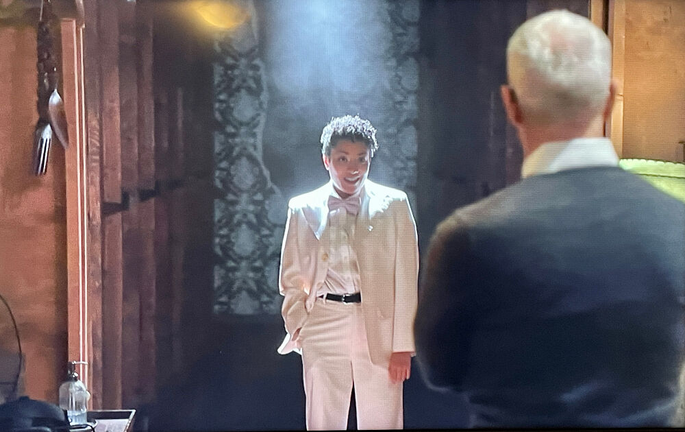 Denver Center actor Kristina Fountaine, playing 'David,' addresses' '60 Minutes' correspondent Anderson Cooper at a special performance of David Byrne's 'Theatre of the Mind.' (CBS screenshot)
