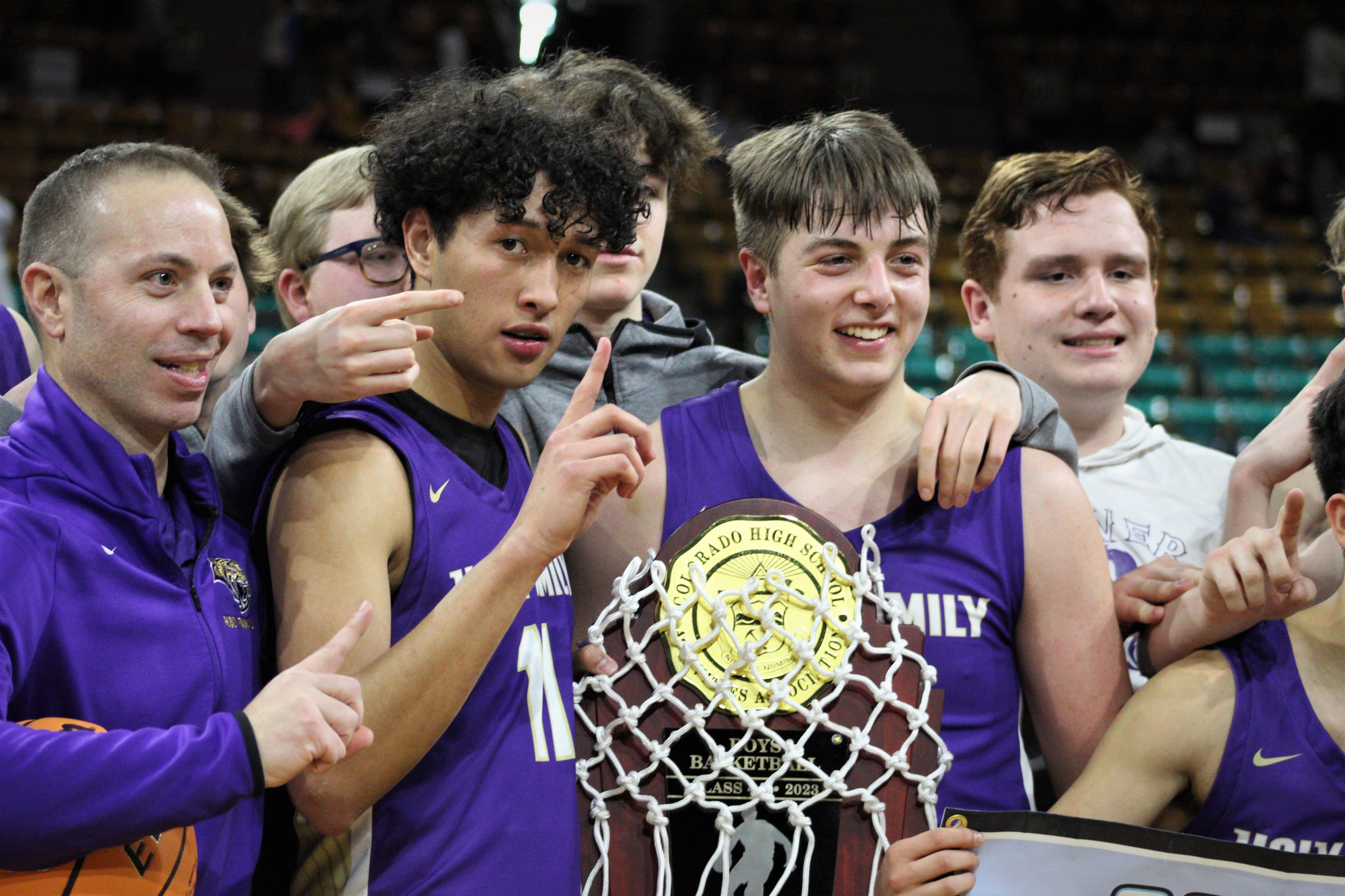 The Holy Family boys basketball team celebrates after defeating Resurrection Christian in the 4A CHSAA state championship game on Saturday, Dec. 11, 2023 at the Denver Coliseum. (Tyler King, The Denver Gazette)