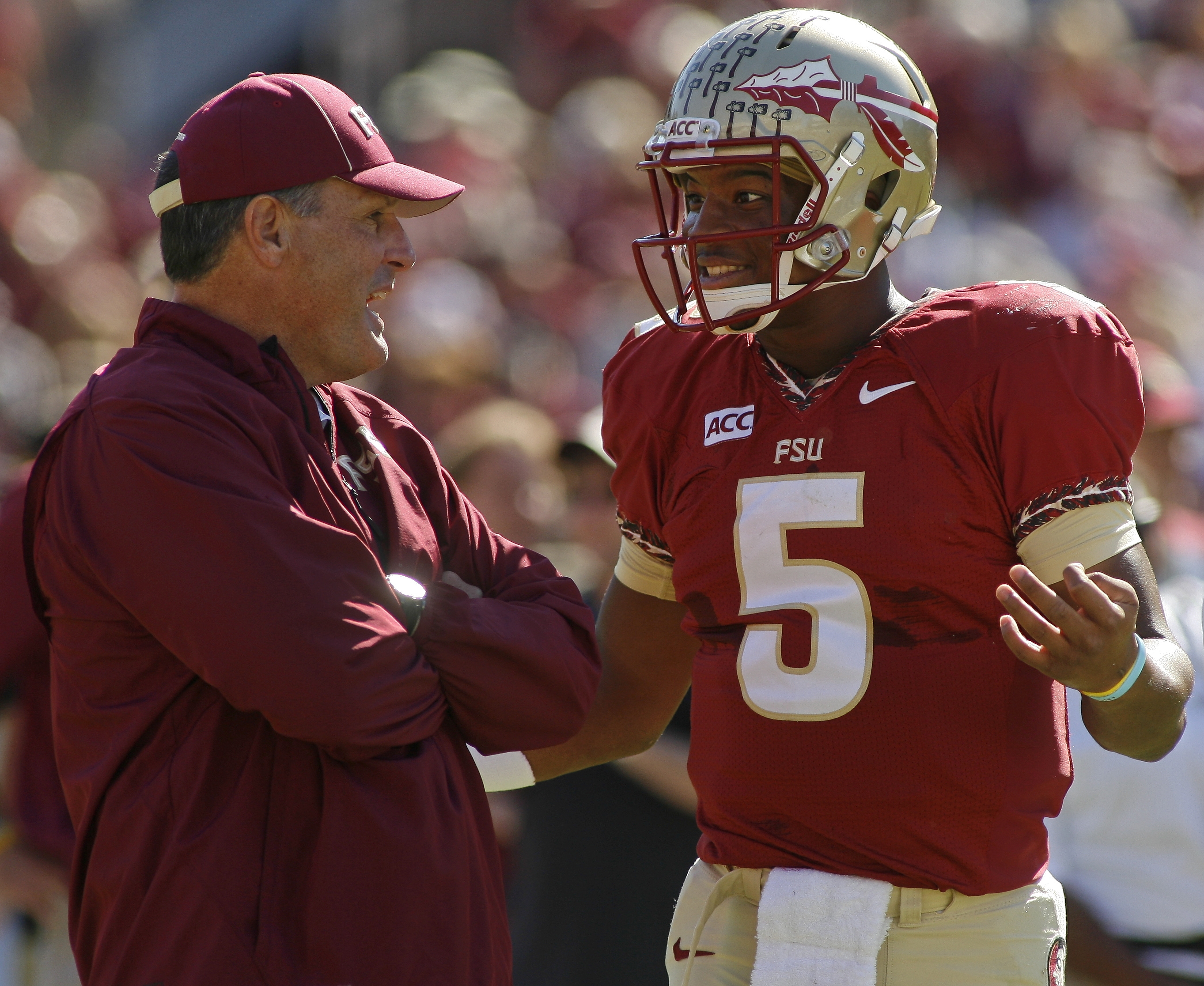 Florida State tight ends coach Tim Brewster chats with quarterback Jameis Winston (5) before the start of an NCAA college football game against North Carolina State on Saturday, Oct. 26, 2013, in Tallahassee, Fla. Florida State beat North Carolina State 49-17. (AP Photo/Phil Sears) (Phil G. Sears)