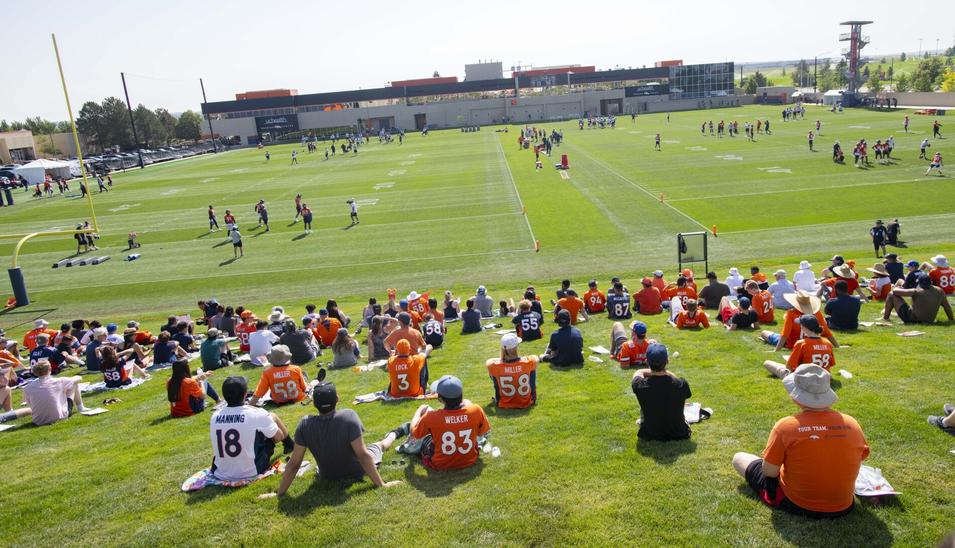 Fans watch the Broncos practice Wednesday, July 28, 2021, on the first day of the Broncos training camp at UCHealth Training Center in Englewood. (The Gazette, Christian Murdock) (Christian Murdock/The Gazette)