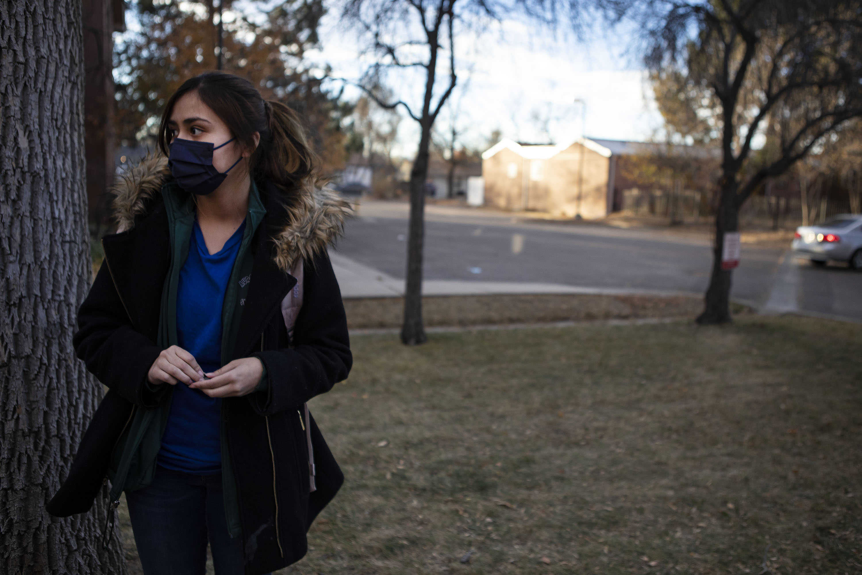 Aurora Central High School sophomore Persais De Haro waits for her father to pick her up after school after a shooting occurred at nearby Nome Park on Monday, Nov. 15, 2021, in Aurora, Colo. (Timothy Hurst/The Gazette) (Timothy Hurst)