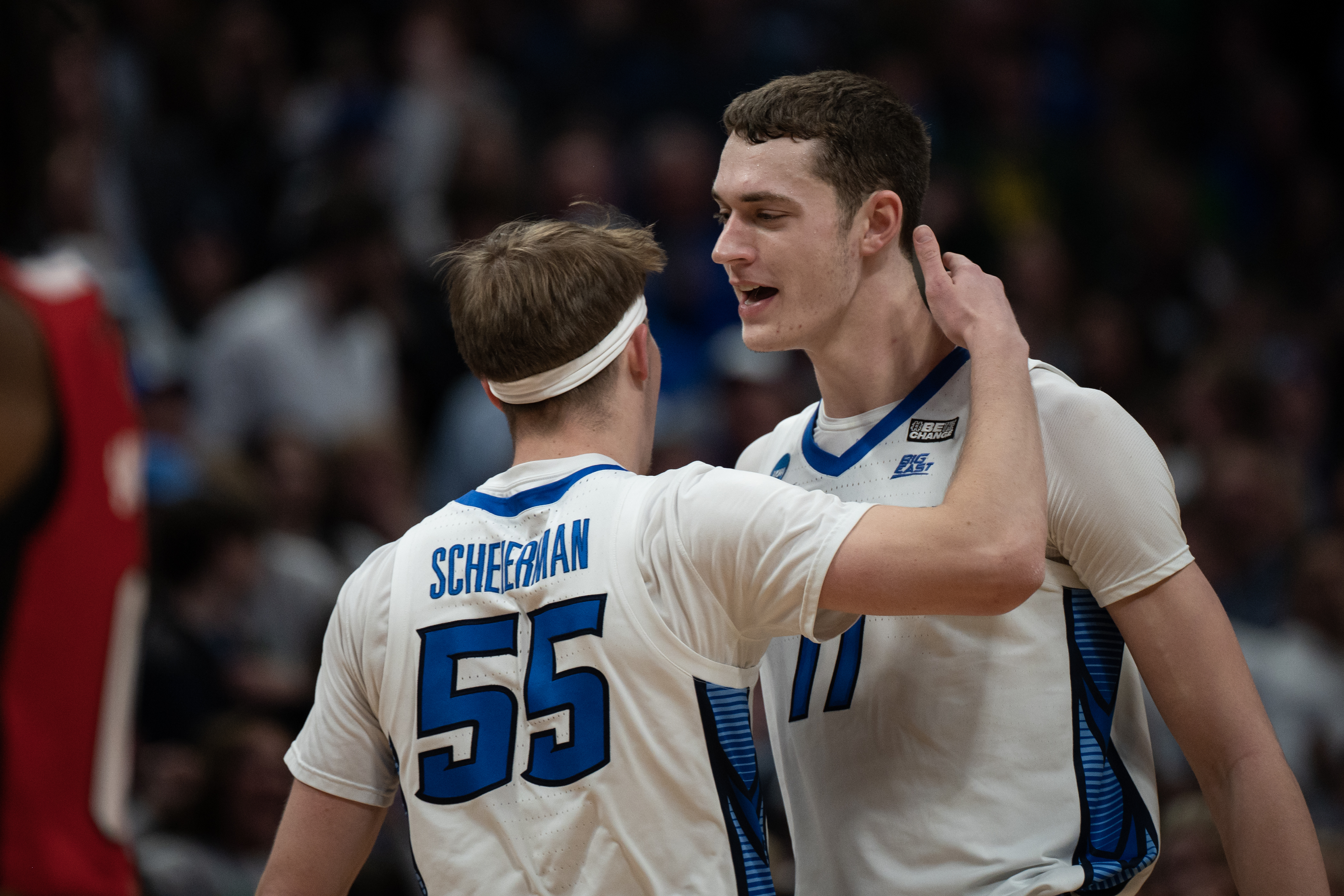 Creighton Bluejays center Ryan Kalkbrenner (11) gets a hug from Creighton Bluejays guard Baylor Scheierman (55) during a first-round college basketball game against North Carolina State in the NCAA Tournament on Friday, March 17, 2023, at Ball Arena in Denver, Colo. (Timothy Hurst/Denver Gazette) (TimHursttim.hurst@gazette.comhttps://secure.gravatar.com/avatar/aca82bd62b4ee425c598527cd6faa1b1?d=mm&r=g)
