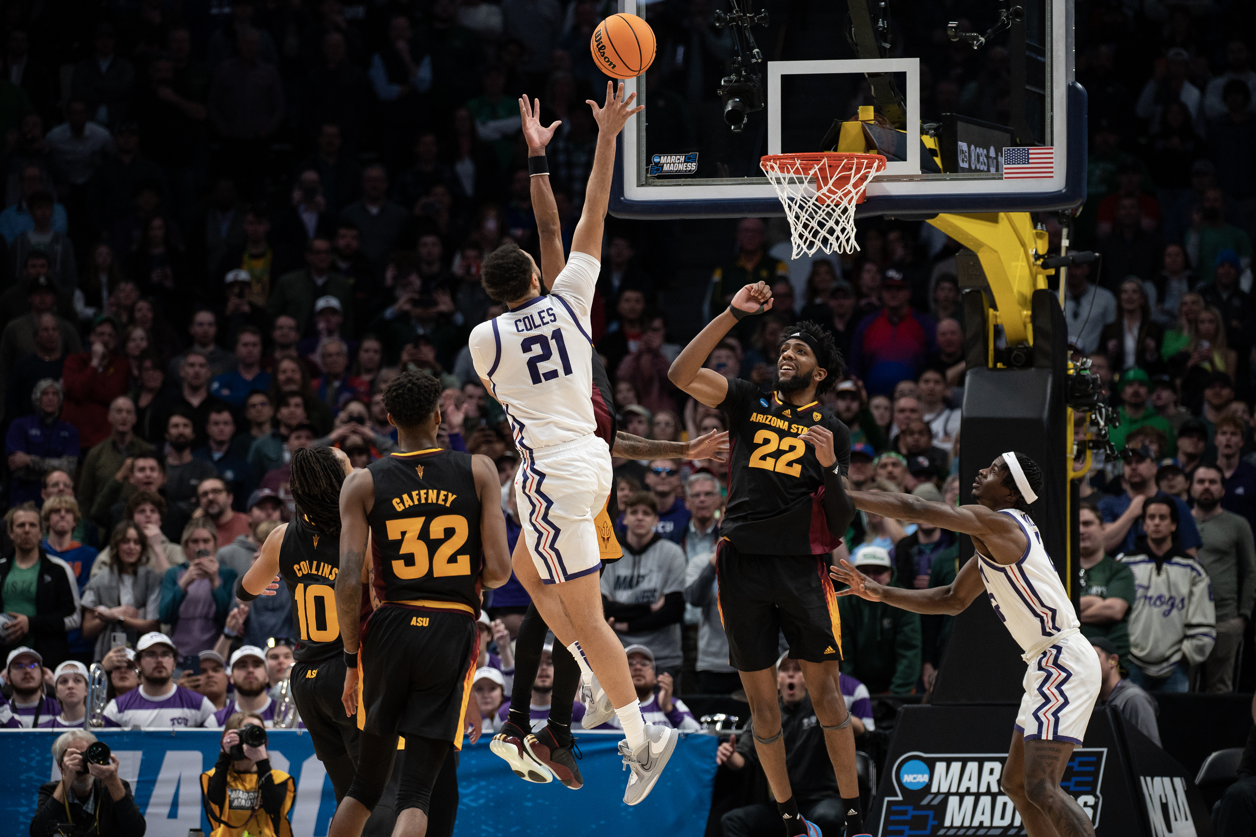 TCU Horned Frogs forward JaKobe Coles (21) score the final points to put his team ahead late in the second half against the Arizona State Sun Devils during a first-round college basketball game in the NCAA Tournament on Friday, March 17, 2023, at Ball Arena in Denver, Colo. (Timothy Hurst/Denver Gazette) (TimHursttim.hurst@gazette.comhttps://secure.gravatar.com/avatar/aca82bd62b4ee425c598527cd6faa1b1?d=mm&r=g)