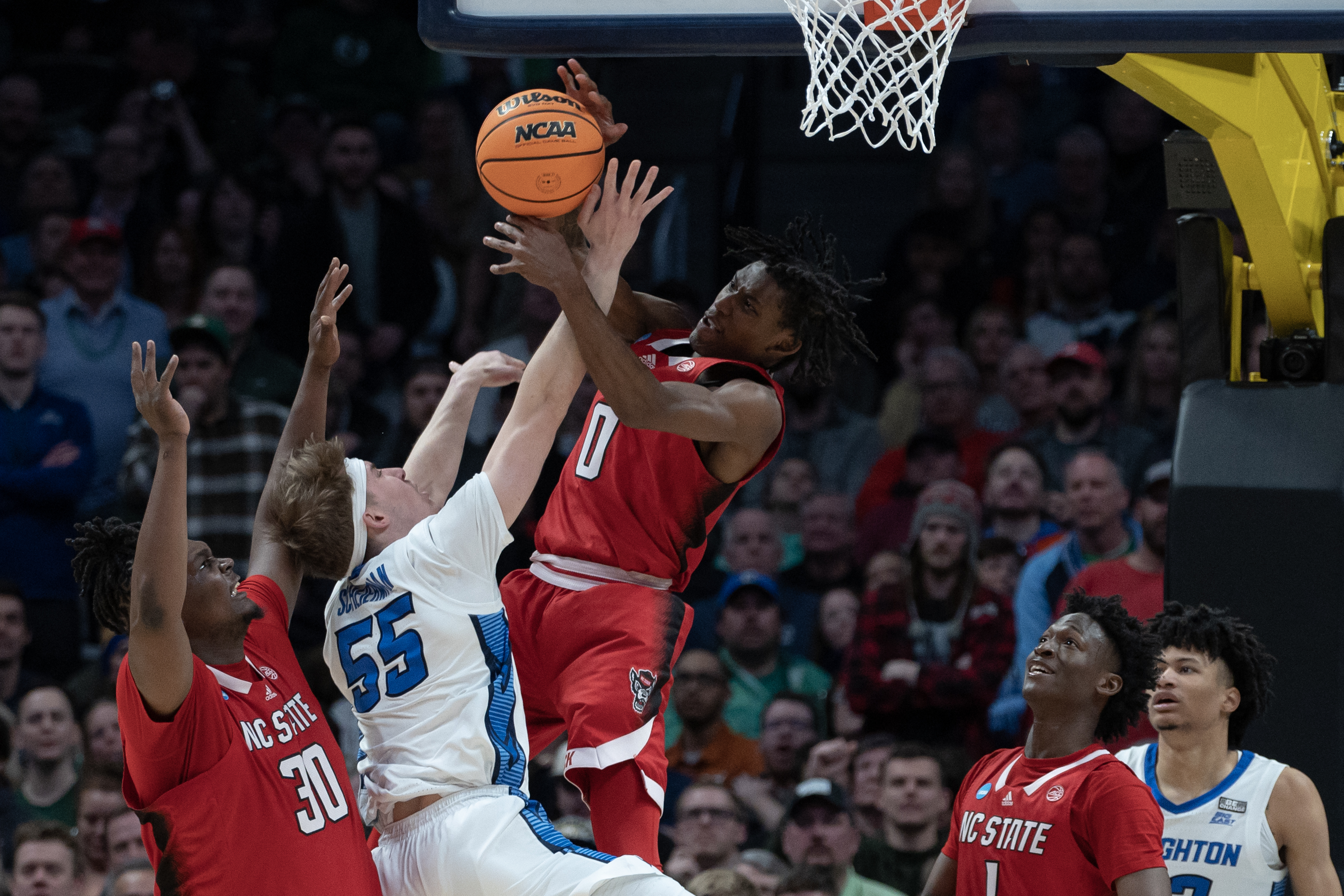 North Carolina State Wolfpack guard Terquavion Smith (0) blocks a shot by Creighton Bluejays guard Baylor Scheierman (55) during a first-round college basketball game in the NCAA Tournament on Friday, March 17, 2023, at Ball Arena in Denver, Colo. (Timothy Hurst/Denver Gazette) (TimHursttim.hurst@gazette.comhttps://secure.gravatar.com/avatar/aca82bd62b4ee425c598527cd6faa1b1?d=mm&r=g)