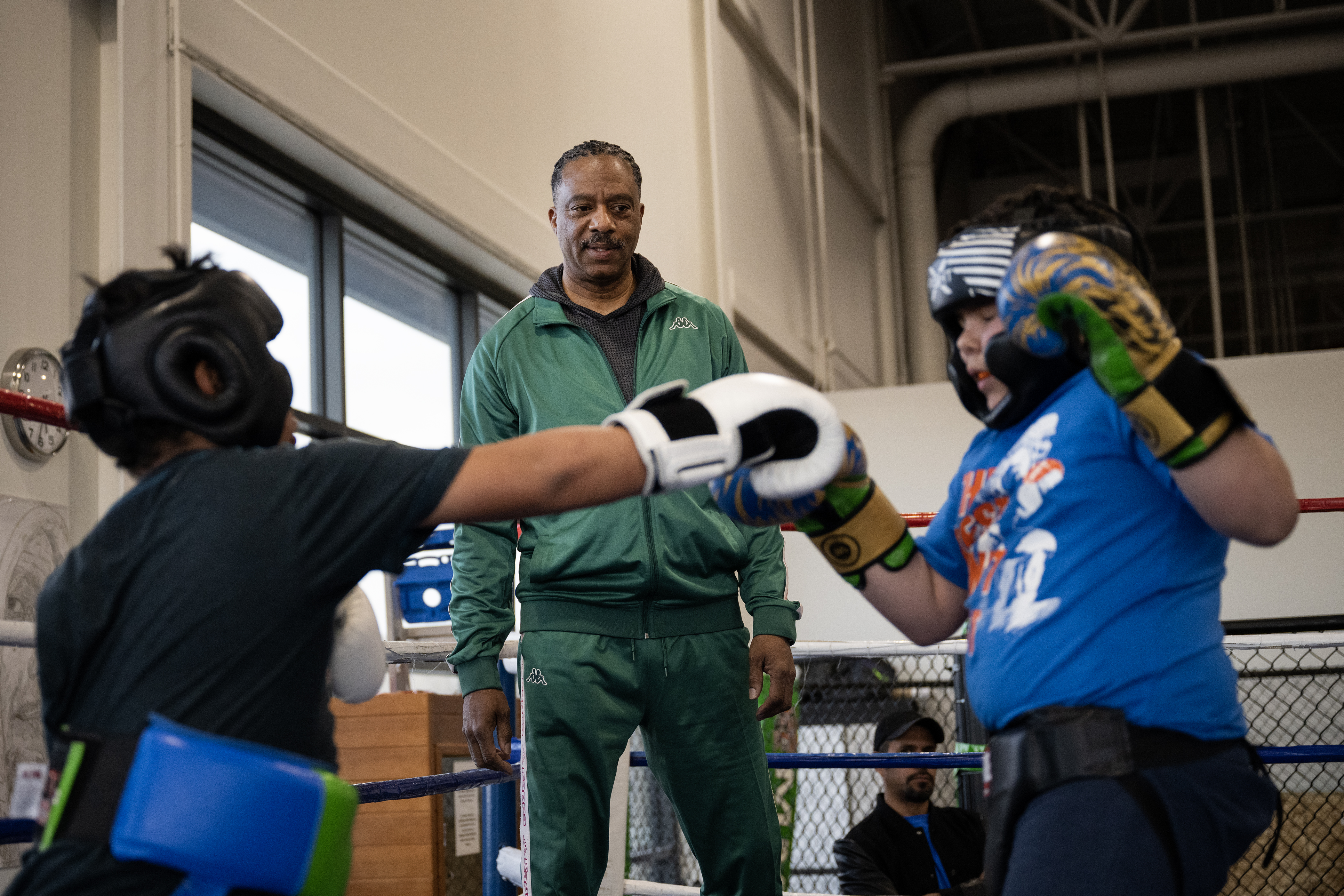 Gym owner Glenn Goodson looks on as two young boxers spar on Thursday, March 16, 2023, at A1 Boxing Academy, Colo. (Timothy Hurst/Denver Gazette) (TimHursttim.hurst@gazette.comhttps://secure.gravatar.com/avatar/aca82bd62b4ee425c598527cd6faa1b1?d=mm&r=g)