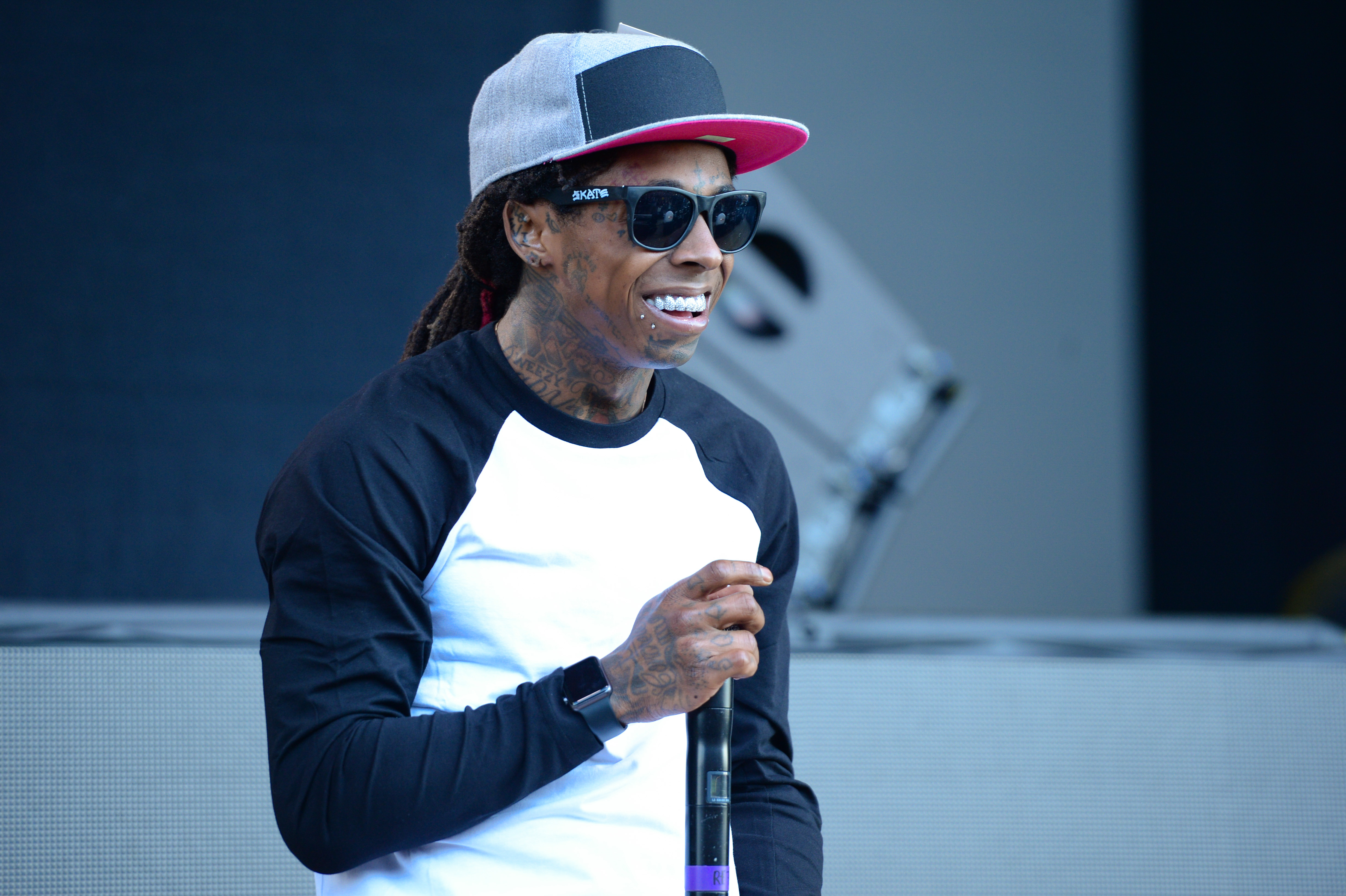 Rapper Lil Wayne performs at the 2015 Billboard Hot 100 Music Festival at Nikon at Jones Beach Theater on Saturday, Aug. 22, 2015, in Wantagh, N.Y. (Photo by Scott Roth/Invision/AP) (Scott Roth/Associated Press)