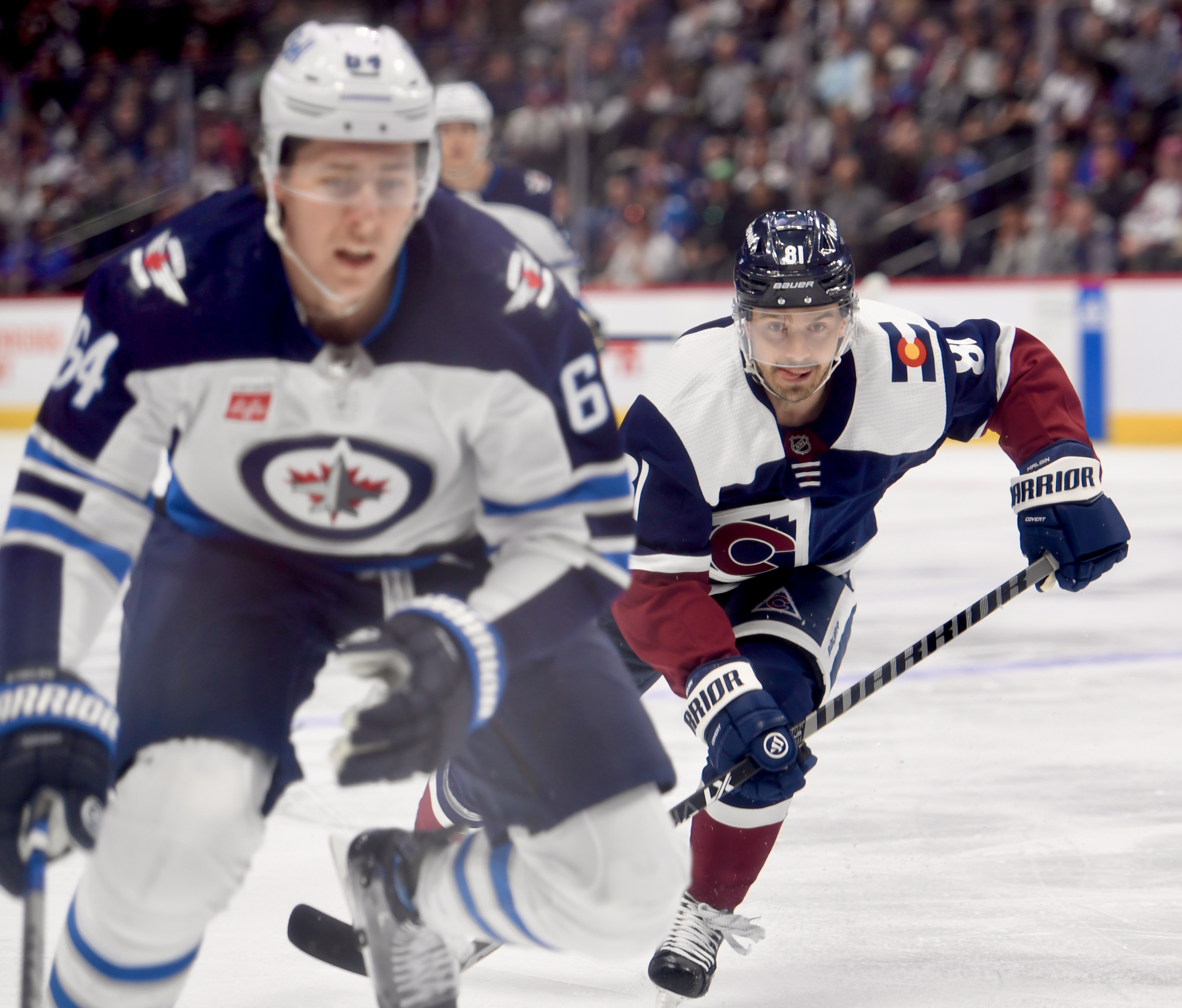 Avs forward Denis Malgin chases after a puck against the Winnipeg Jets on Thursday, April 13, 2023. (CarsonFieldcarson.field@gazette.comhttps://secure.gravatar.com/avatar/c524ef3d384945349bed78d70eb2d2cd?d=mm&r=g)