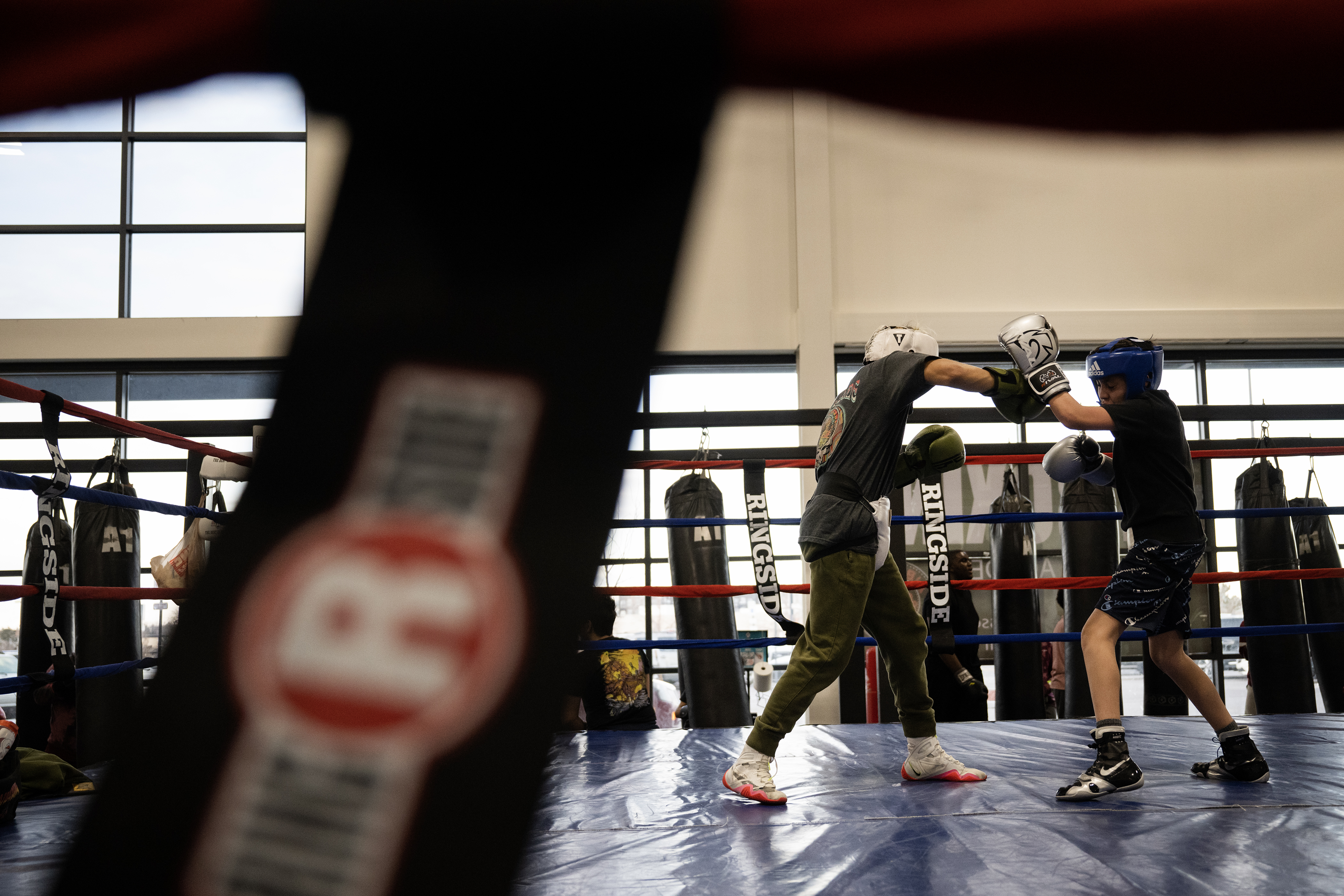 Fabian Cobos, 13, throws a punch at Marcus Martinez, 13, as the two spar on Thursday, March 16, 2023, at A1 Boxing Academy, Colo. (Timothy Hurst/Denver Gazette) (TimHursttim.hurst@gazette.comhttps://secure.gravatar.com/avatar/aca82bd62b4ee425c598527cd6faa1b1?d=mm&r=g)