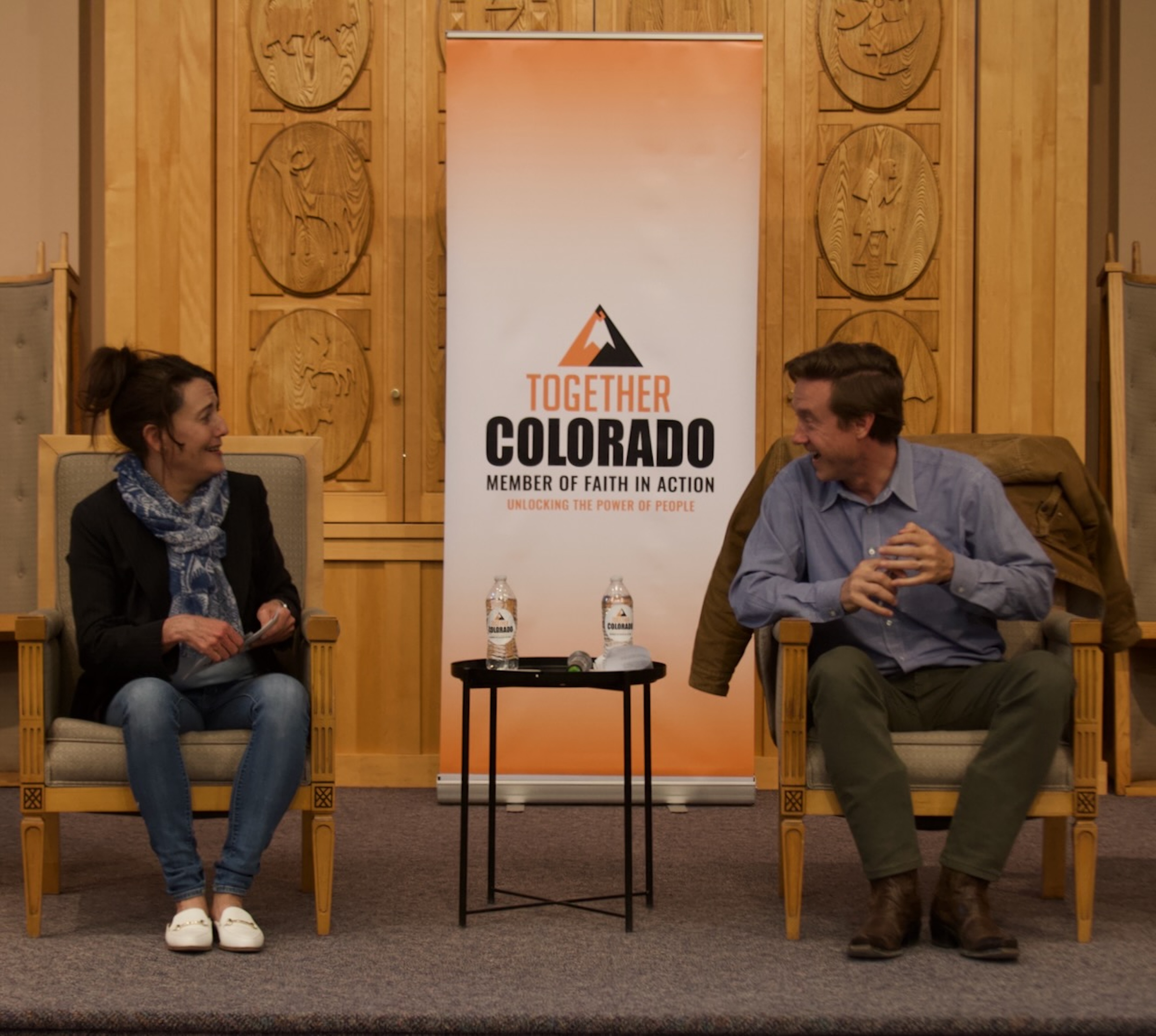 Kelly Brough and Mike Johnston chat before a debate on April 27. (Alex Edwards/The Denver Gazette)