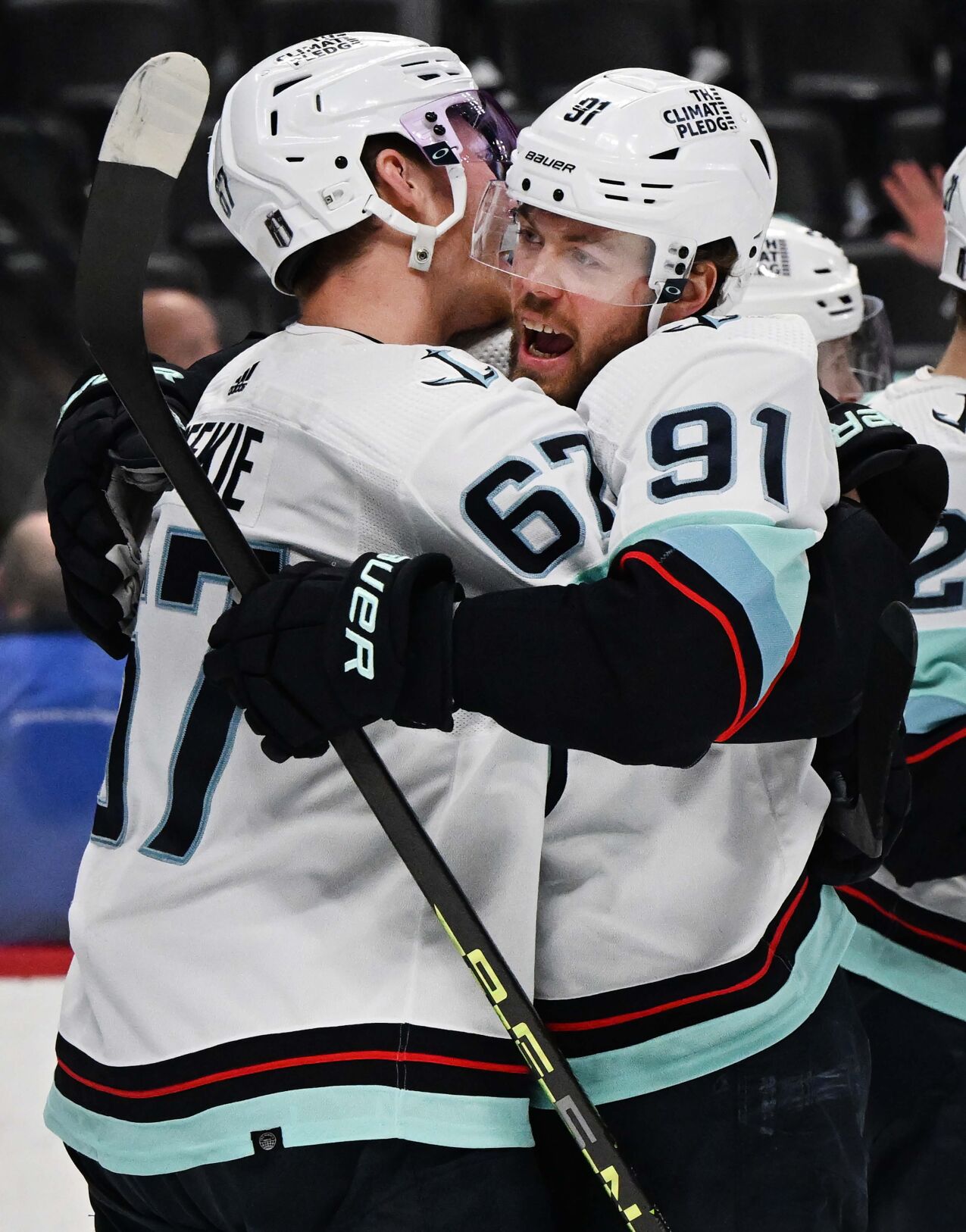 Seattle Kraken center Morgan Geekie (67) and ight wing Daniel Sprong (91) celebrate after defeating the Colorado Avalanche in Game 7 of the first round of the Stanley Cup Playoffs Sunday, April 30, 2023, at Ball Arena in Denver. The Seattle Kraken won 2-1 to advance in playoffs. (The Gazette, Christian Murdock) (Christian Murdock/The Gazette)