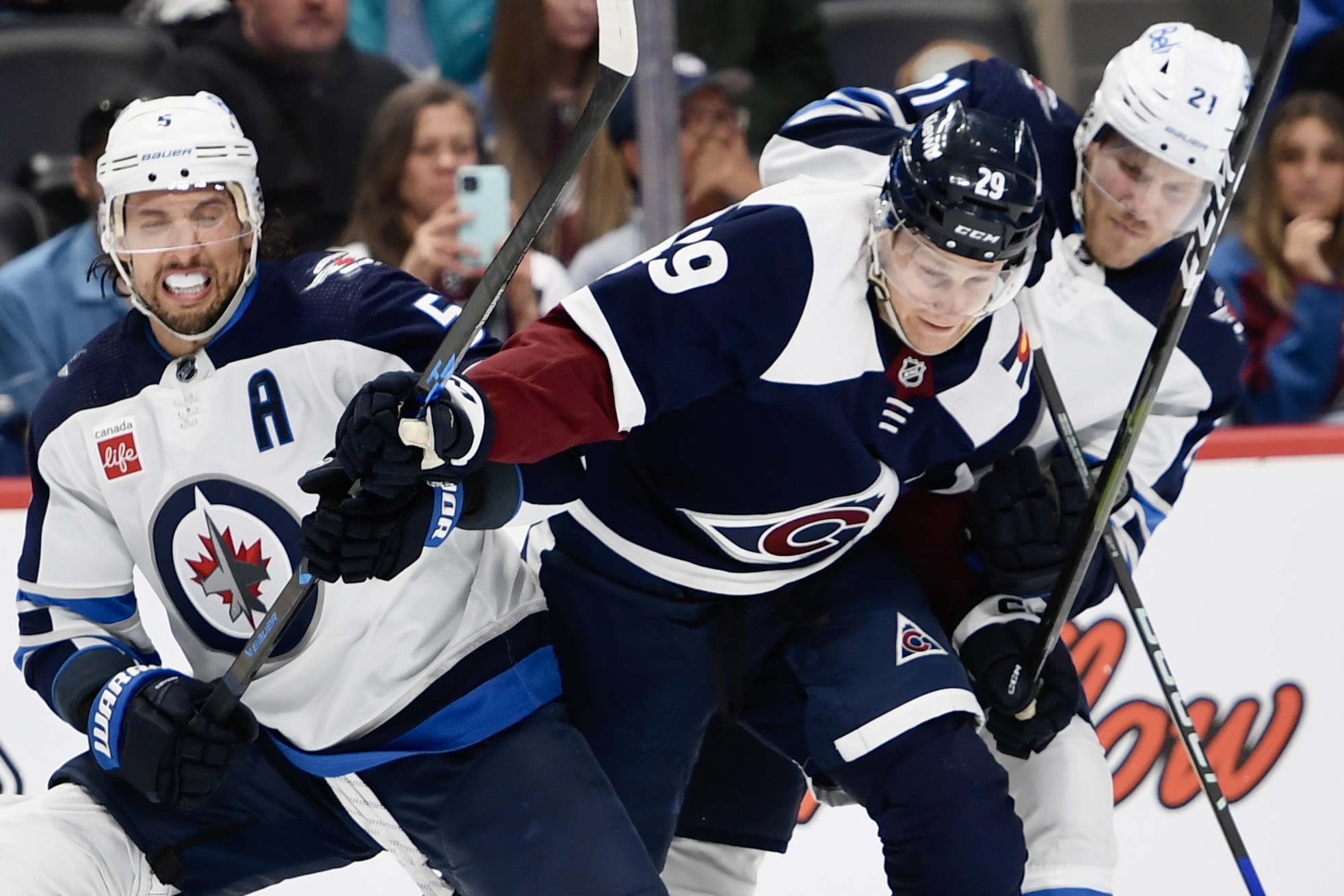 Colorado Avalanche forward Nathan MacKinnon pushes between two Winnipeg Jets defenders on Thursday, April 13, 2023, at Ball Arena. (CarsonFieldcarson.field@gazette.comhttps://secure.gravatar.com/avatar/c524ef3d384945349bed78d70eb2d2cd?d=mm&r=g)
