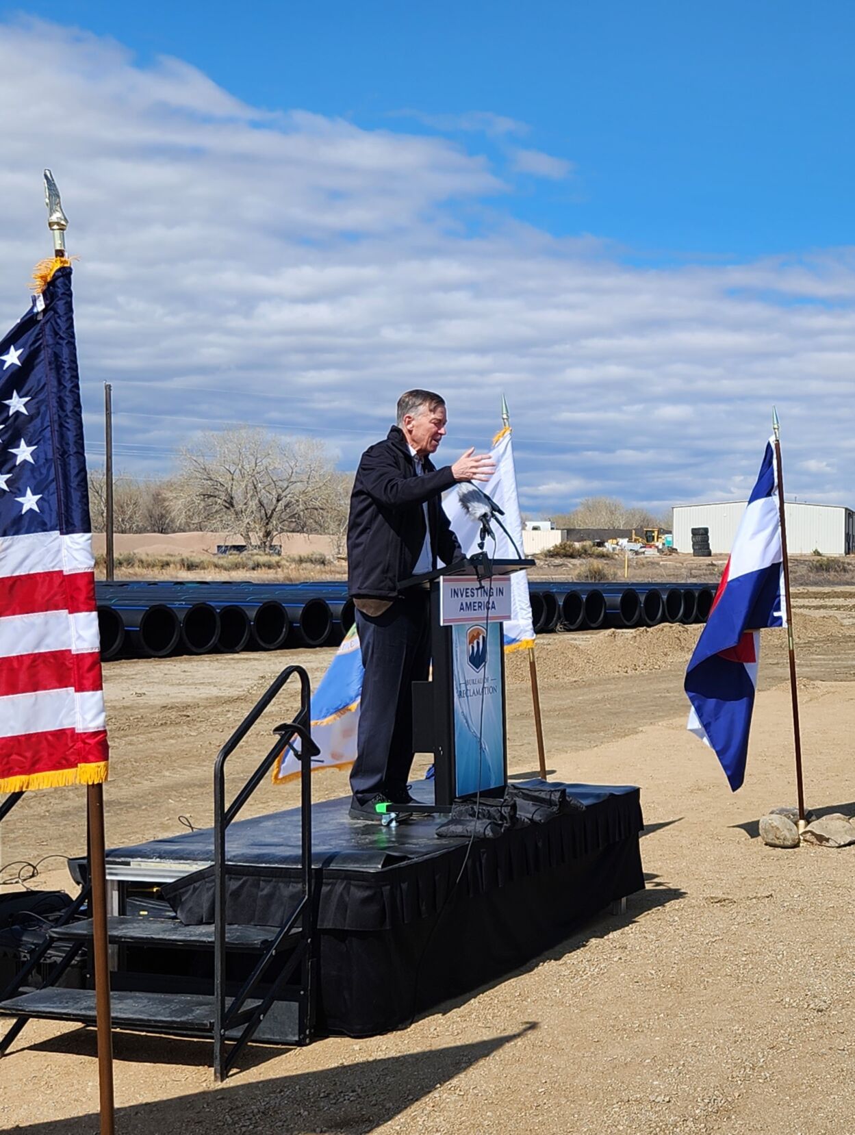 Sen. John Hickenlooper, D-Colo, speaks at an April 28, 2023 event to celebrate the construction of the Arkansas Valley Conduit along U.S. 96 near Pueblo. The conduit will bring water to residents with high levels of radium in their water. (Mary Shinn, The Gazette)