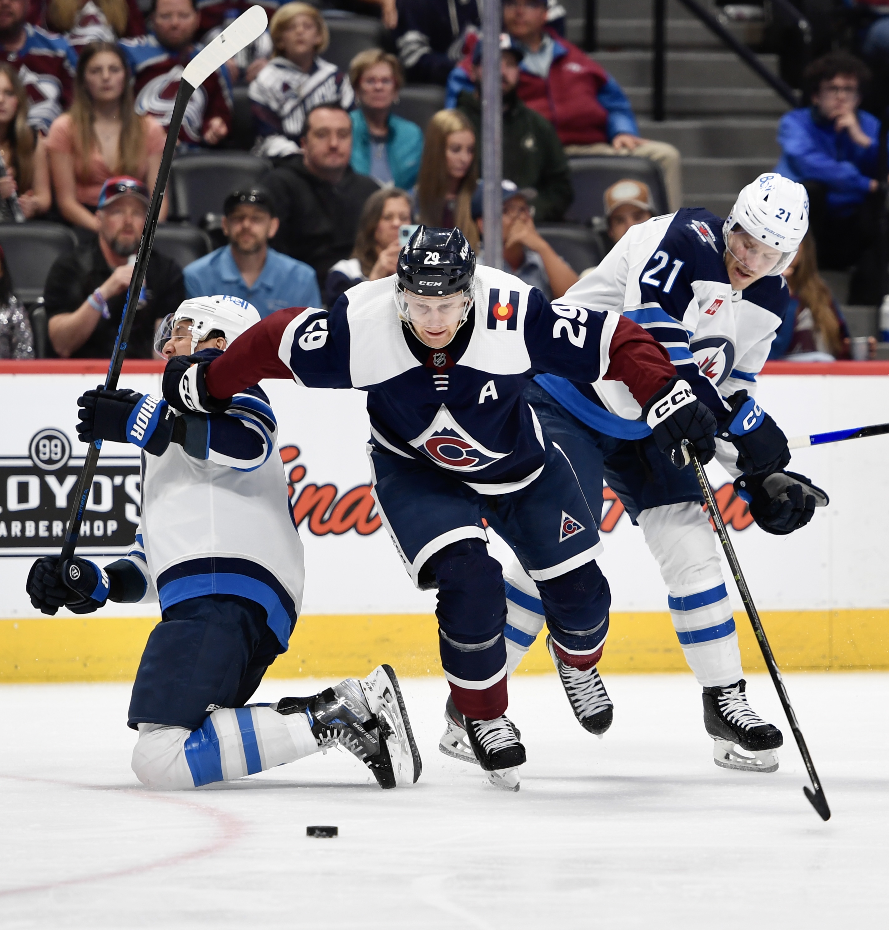 Colorado Avalanche forward Nathan MacKinnon pushes between two Winnipeg defenders on Thursday, April 13, 2023, at Ball Arena. (CarsonFieldcarson.field@gazette.comhttps://secure.gravatar.com/avatar/c524ef3d384945349bed78d70eb2d2cd?d=mm&r=g)