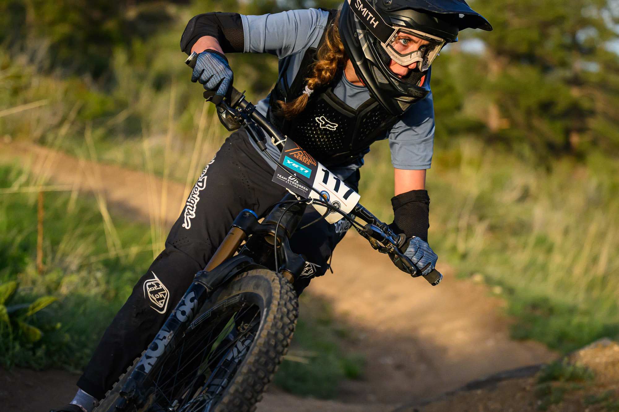 A mountain bike racer leans her bike on The Sluice trail during a descent in the Series Session at Floyd Hill west of Genesee, Colorado. (Courtesy, Eddie Clark)