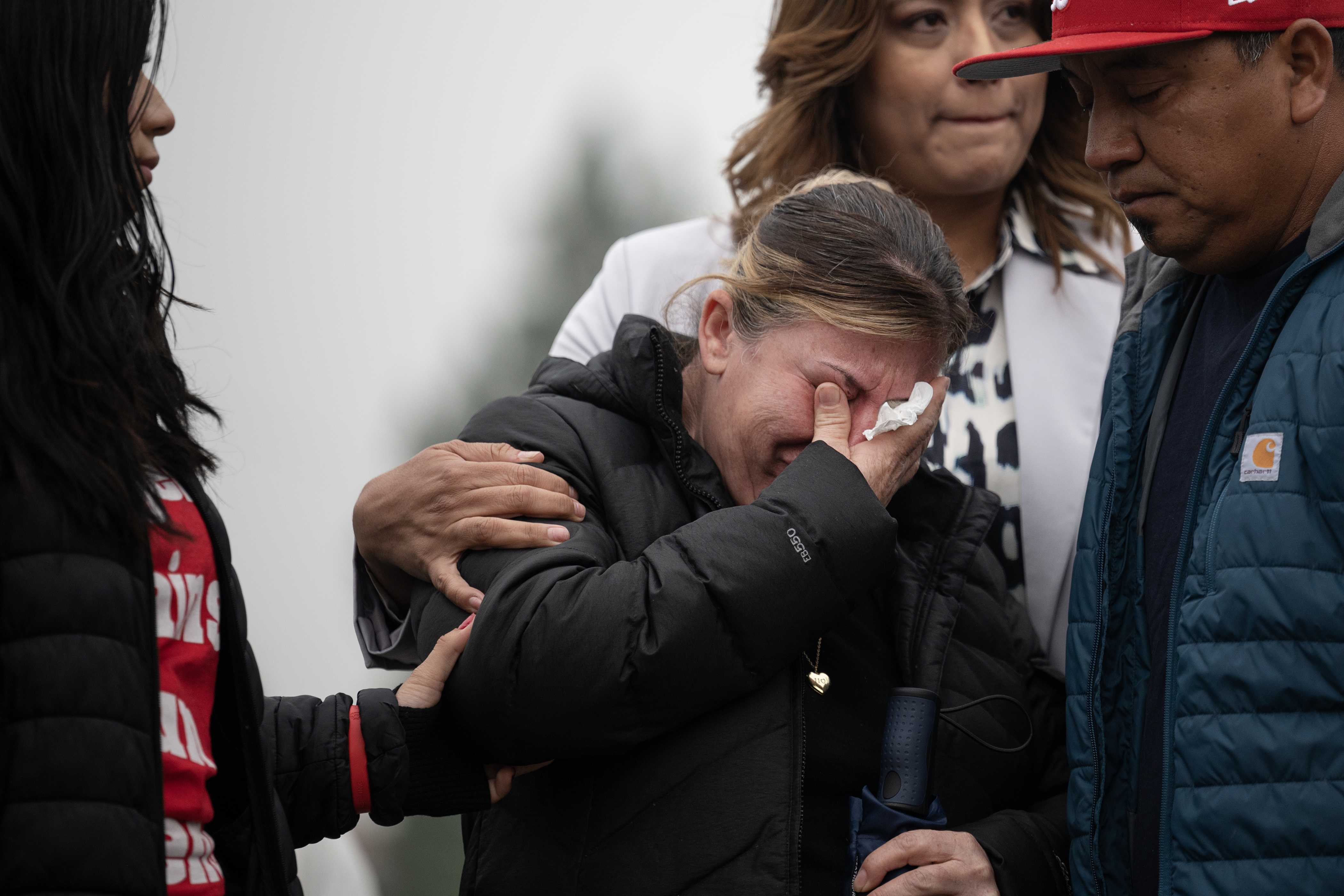Criselda Bobadilla Sandoval, the mother of Luis Garcia, who was shot on February 13th in front of East High School and died two weeks later from his injuries, is comforted by Garcia’s sister Jovana Garcia Bobadilla, left, and father Santos Garcia, right, before a press conference in front of the Thatcher Memorial Fountain on Friday, May 19, 2023, at City Park in Denver. (Timothy Hurst/Denver Gazette) (TimHursttim.hurst@gazette.comhttps://secure.gravatar.com/avatar/aca82bd62b4ee425c598527cd6faa1b1?d=mm&r=g)