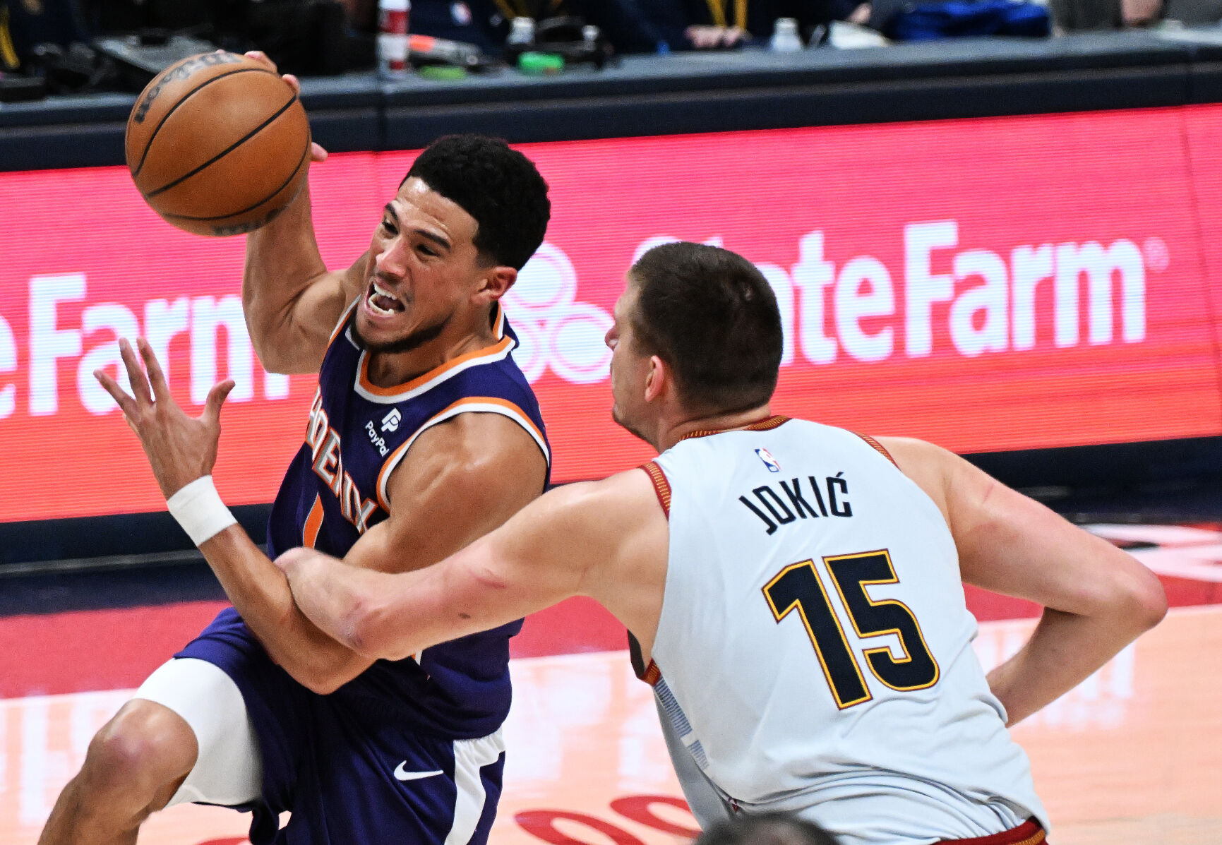 Nuggets Nikola Jokic defends Suns Devin Booker and fouls him in the second quarter of game 5 of the second round of the Western Conference NBA Playoffs at Ball Arena on Tuesday, May 9, 2023. (Photo by Jerilee Bennett, The Gazette)