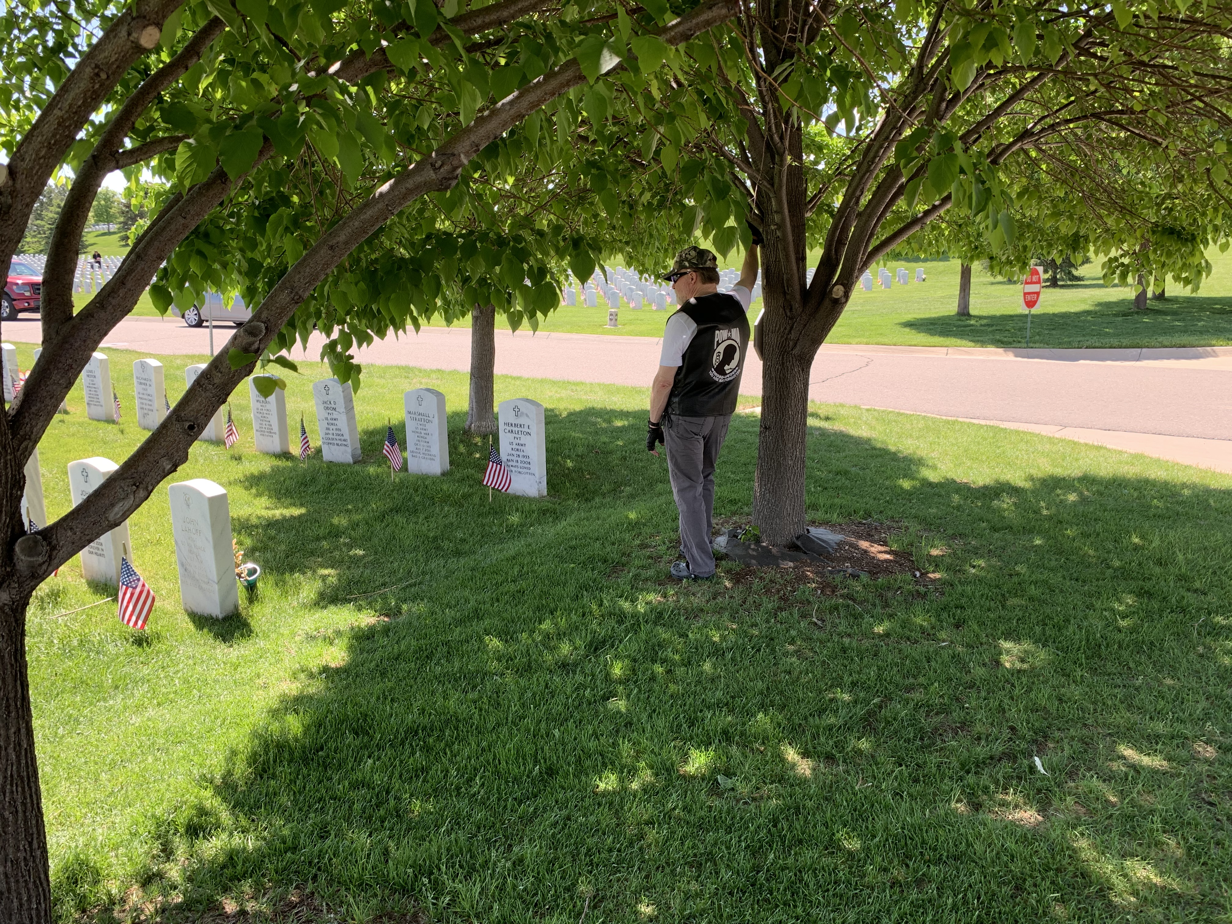 A man reflects under a tree on Memorial Day, Monday, May 9, 2023 at Fort Logan National Cemetery. (DennisHuspeniCity Editordennis.huspeni@gazette.comhttps://denvergazette.com/content/tncms/avatars/c/5a/fbd/c5afbd32-5030-11eb-bdef-030d9de52a9e.779683cee495ffe64766291c251a8894.png)