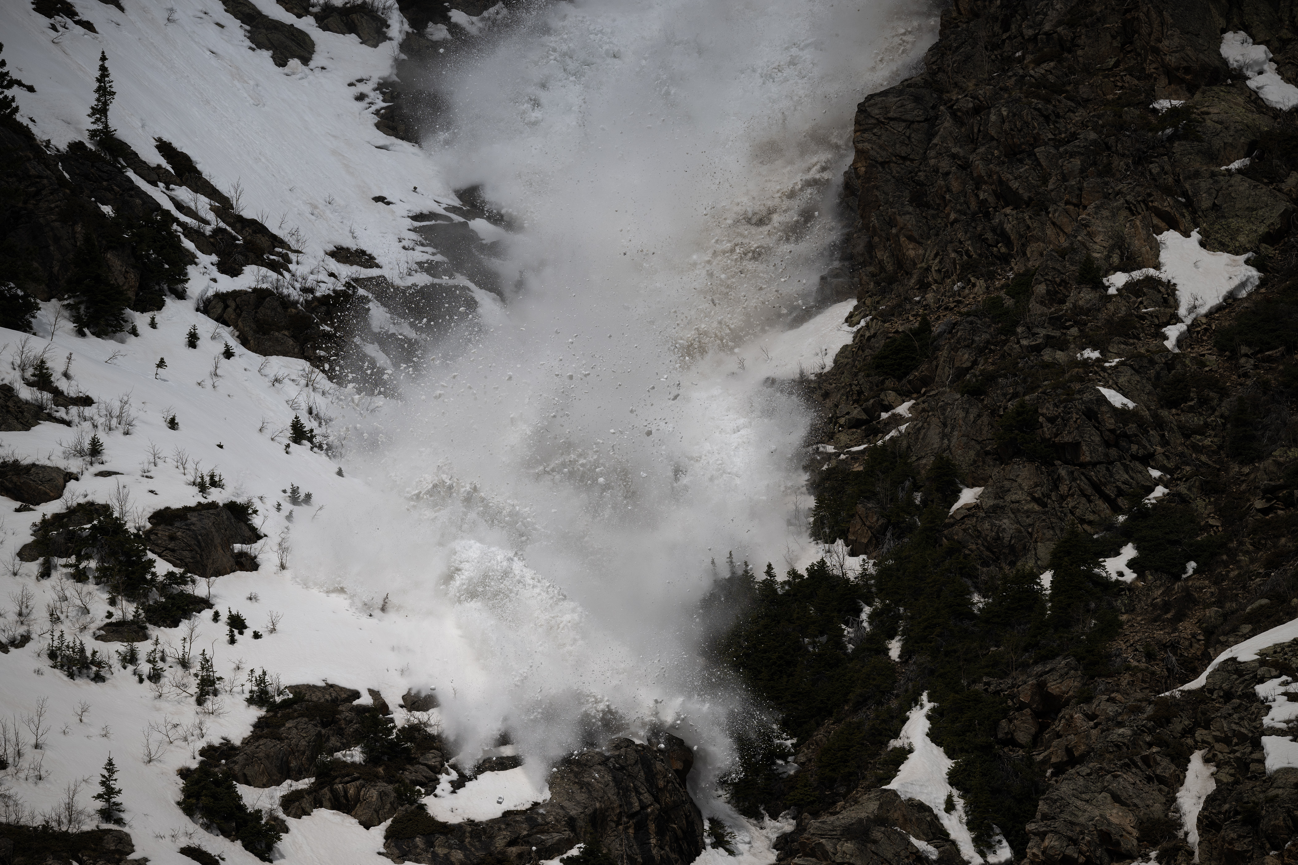 A manmade avalanche crashes down down a gully and onto Colorado 82 on the east side of Independence Pass as Colorado Department of Transportation and Colorado Avalanche Information Center crews for perform avalanche mitigation work in anticipation for clearing and open the highway later this month, as seen on Tuesday, May 2, 2023, in Lake County, Colo. (Timothy Hurst/Denver Gazette) (TimHursttim.hurst@gazette.comhttps://secure.gravatar.com/avatar/aca82bd62b4ee425c598527cd6faa1b1?d=mm&r=g)