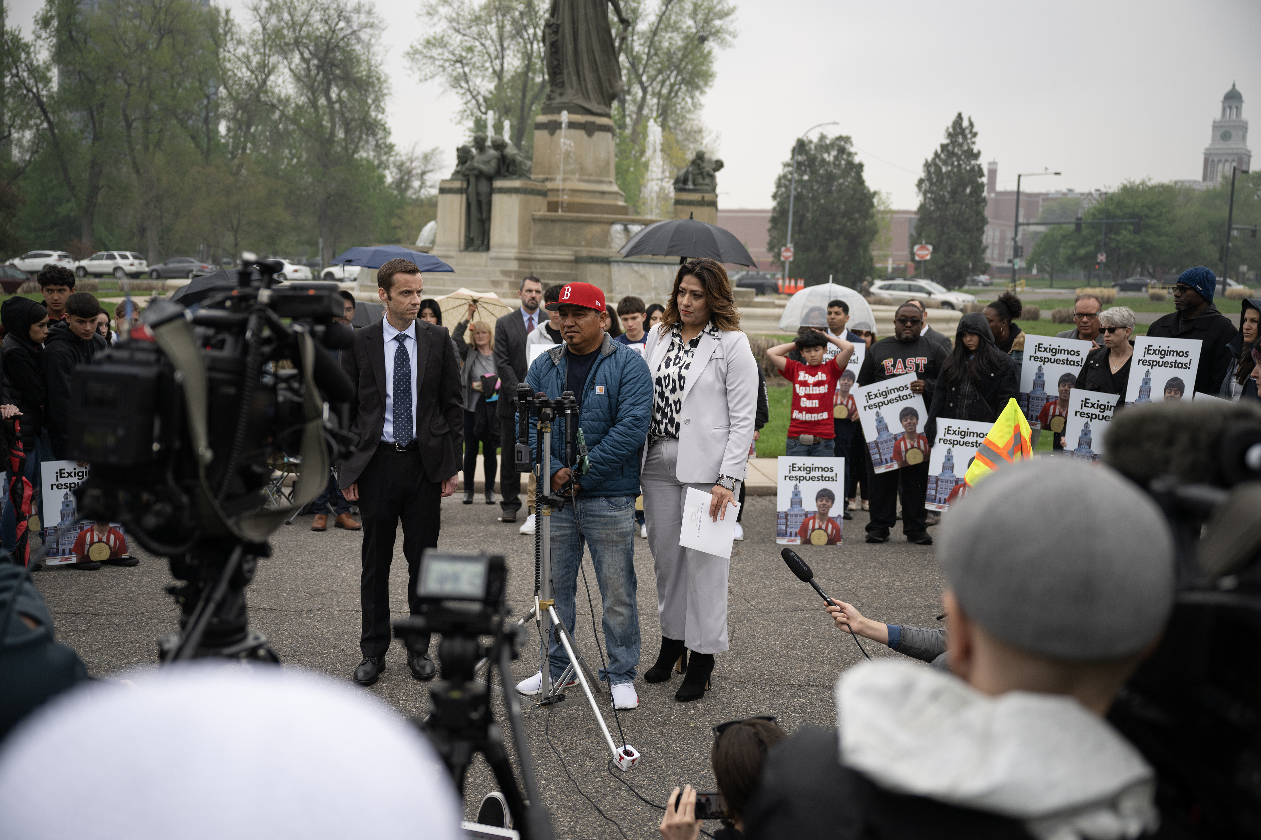 Santos Garcia, the father of Luis Garcia, who was shot on February 13th in front of East High School and died two weeks later from his injuries, speaks to media while Barringer Law Firm office manager Aida Montanez, right, provides translation during a press conference in front of the Thatcher Memorial Fountain on Friday, May 19, 2023, at City Park in Denver. (Timothy Hurst/Denver Gazette) (TimHursttim.hurst@gazette.comhttps://secure.gravatar.com/avatar/aca82bd62b4ee425c598527cd6faa1b1?d=mm&r=g)