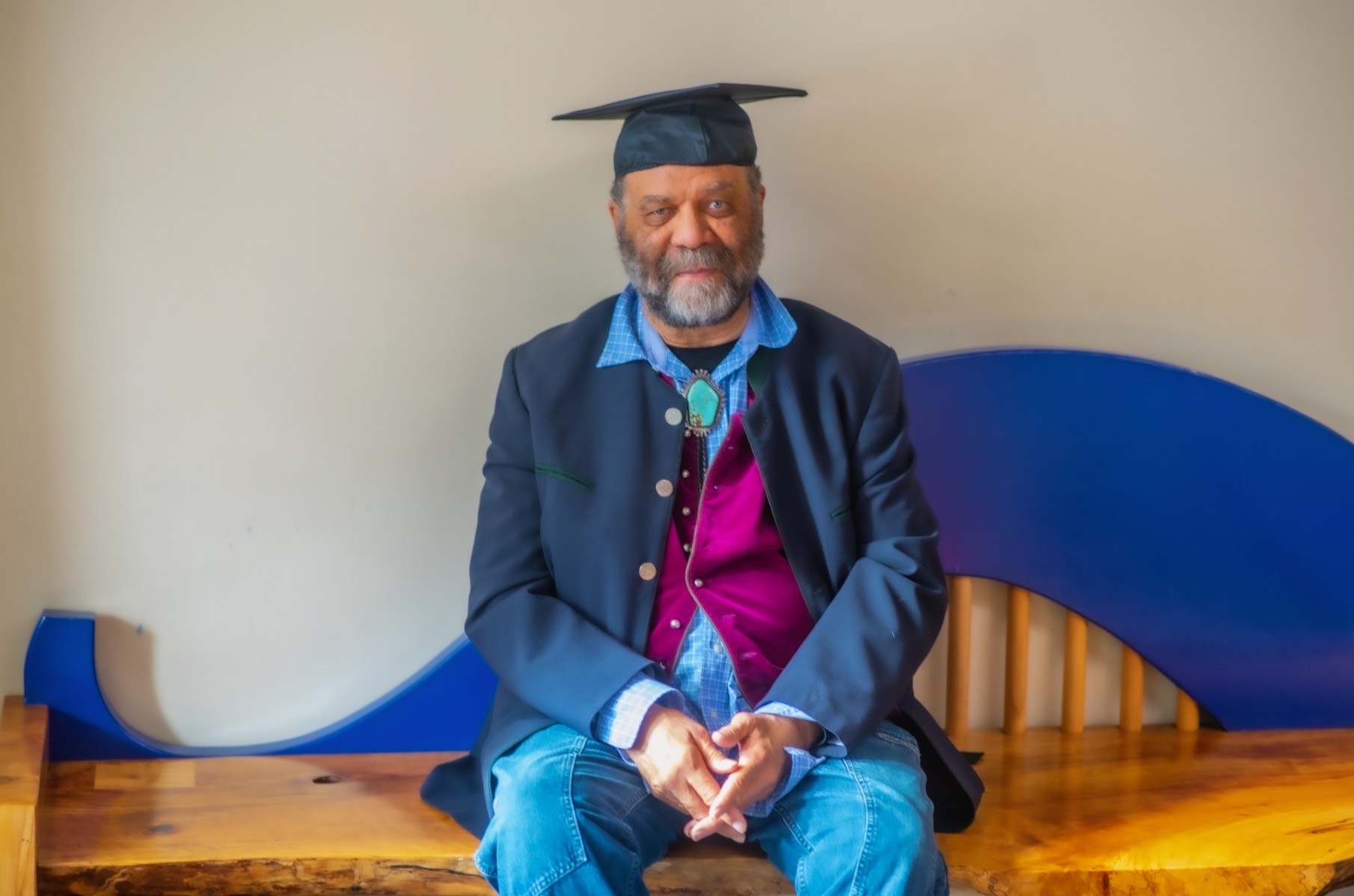 Otis Taylor dons his graduation cap before receiving his 1966 diploma from Manual High School on May 15, 2023. (Evan Semon)