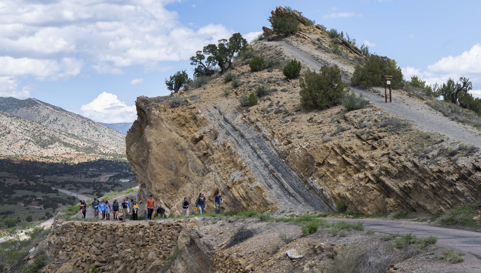 Students from Colorado College walk along Skyline Drive last week after studying the dinosaur tracks from the Cretaceous Period with visiting professor Tyler Grambling. (Christian Murdock/The Gazette)