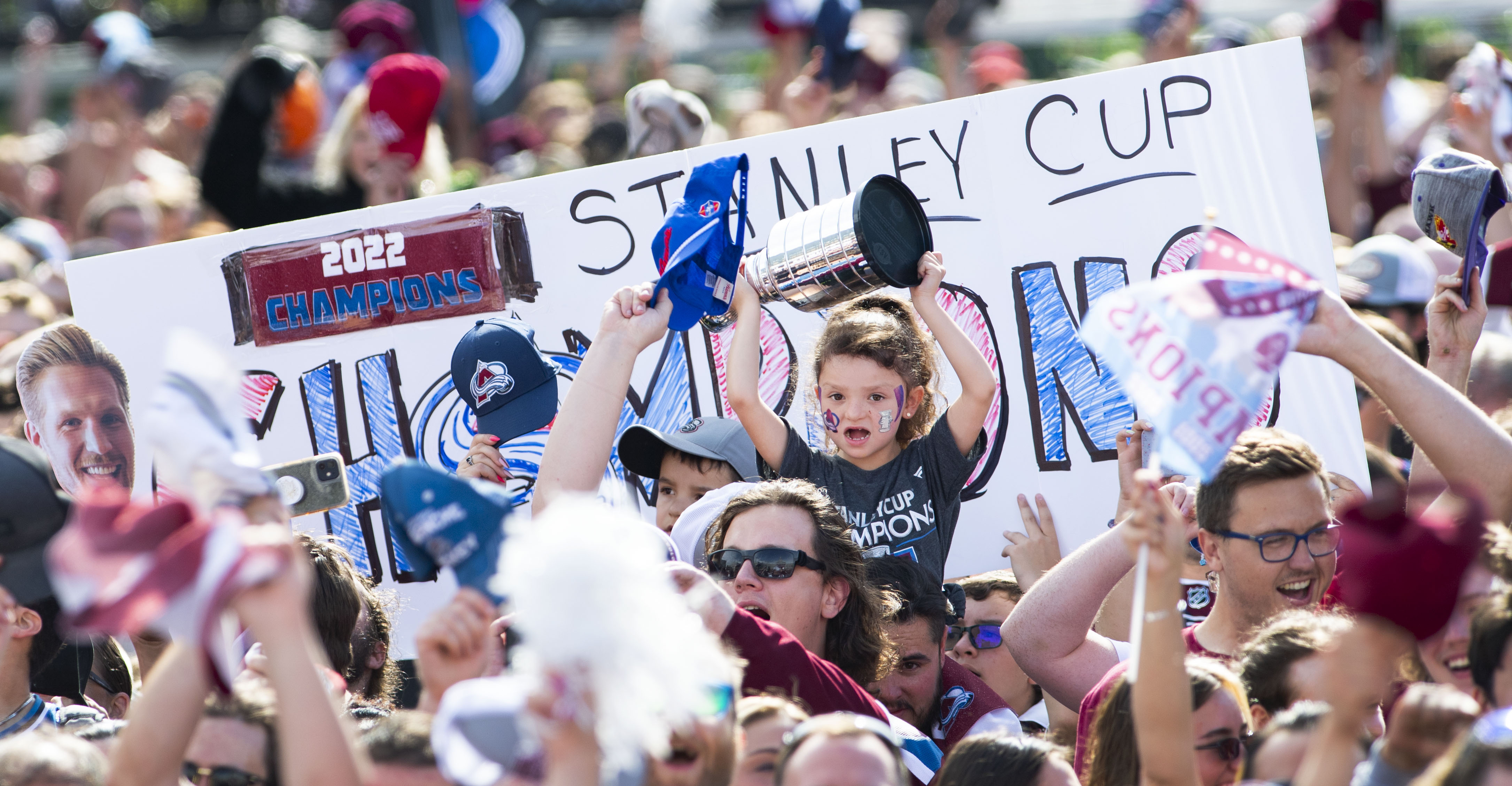 FILE PHOTO: A young fan cheers among the estimated crowd of 500,000 during the Colorado Avalanche 2022 Championship celebration Thursday, June 30, 2022, in Civic Center Park in Denver. (The Gazette, Christian Murdock) (Christian Murdock/The Denver Gazette)