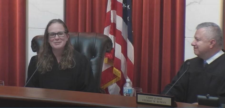 FILE PHOTO: Judge Christina F. Gomez speaks on June 30, 2022 after her formal swearing-in to the Colorado Court of Appeals, with Chief Judge Gilbert M. Román at right. (Colorado Politics file photo)