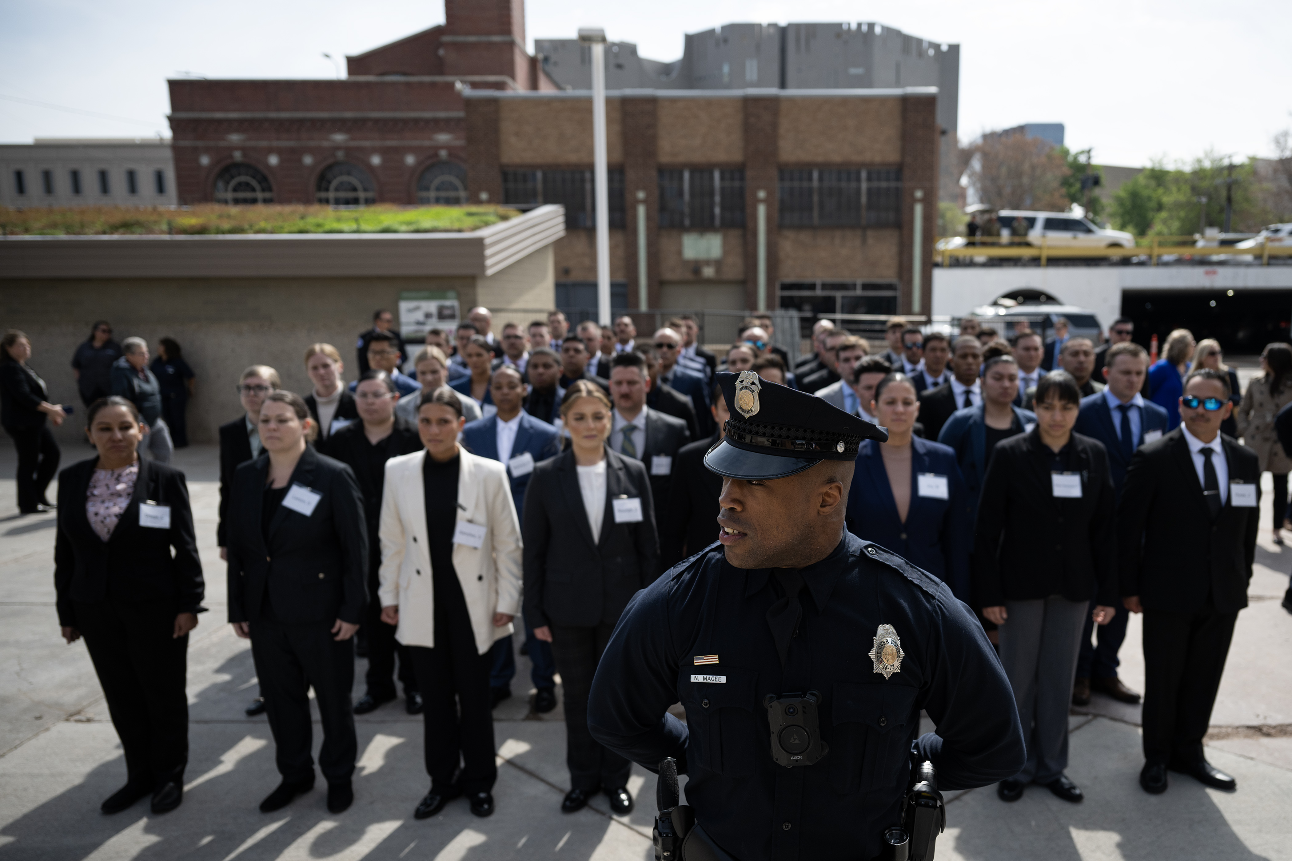 Denver Police Department recruiting unit technician Nate Magee has new recruits get into the parade rest position before DPD’s annual fallen officers memorial ceremony on Thursday, May 18, 2023, at the department’s administration building in Denver, Colo. (Timothy Hurst/Denver Gazette) (TimHursttim.hurst@gazette.comhttps://secure.gravatar.com/avatar/aca82bd62b4ee425c598527cd6faa1b1?d=mm&r=g)