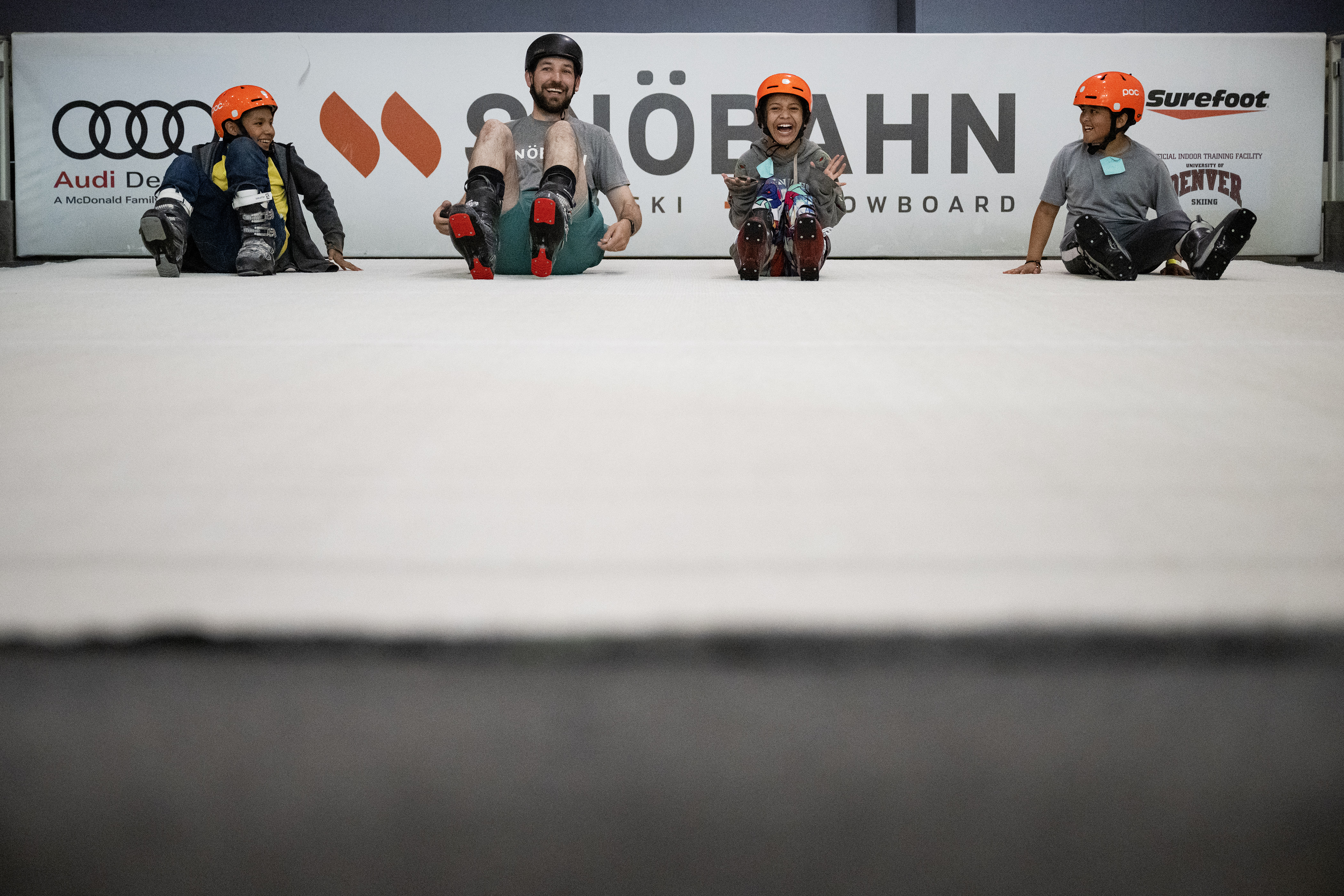 Instructor Mark Beckwith takes Montbello area fifth graders, from left, Alex Lopez, Samantha Hernandez and Maurice Martinez, on what they refer to as the “magic carpet ride” up one of the indoor revolving slopes to finish out their first ski lesson session as part of Chris Anthony’s Youth Initiative Project on Tuesday, May 23, 2023, at SNÖBAHN Indoor Ski + Snowboard Center in Centennial, Colo. (Timothy Hurst/Denver Gazette) (TimHursttim.hurst@gazette.comhttps://secure.gravatar.com/avatar/aca82bd62b4ee425c598527cd6faa1b1?d=mm&r=g)