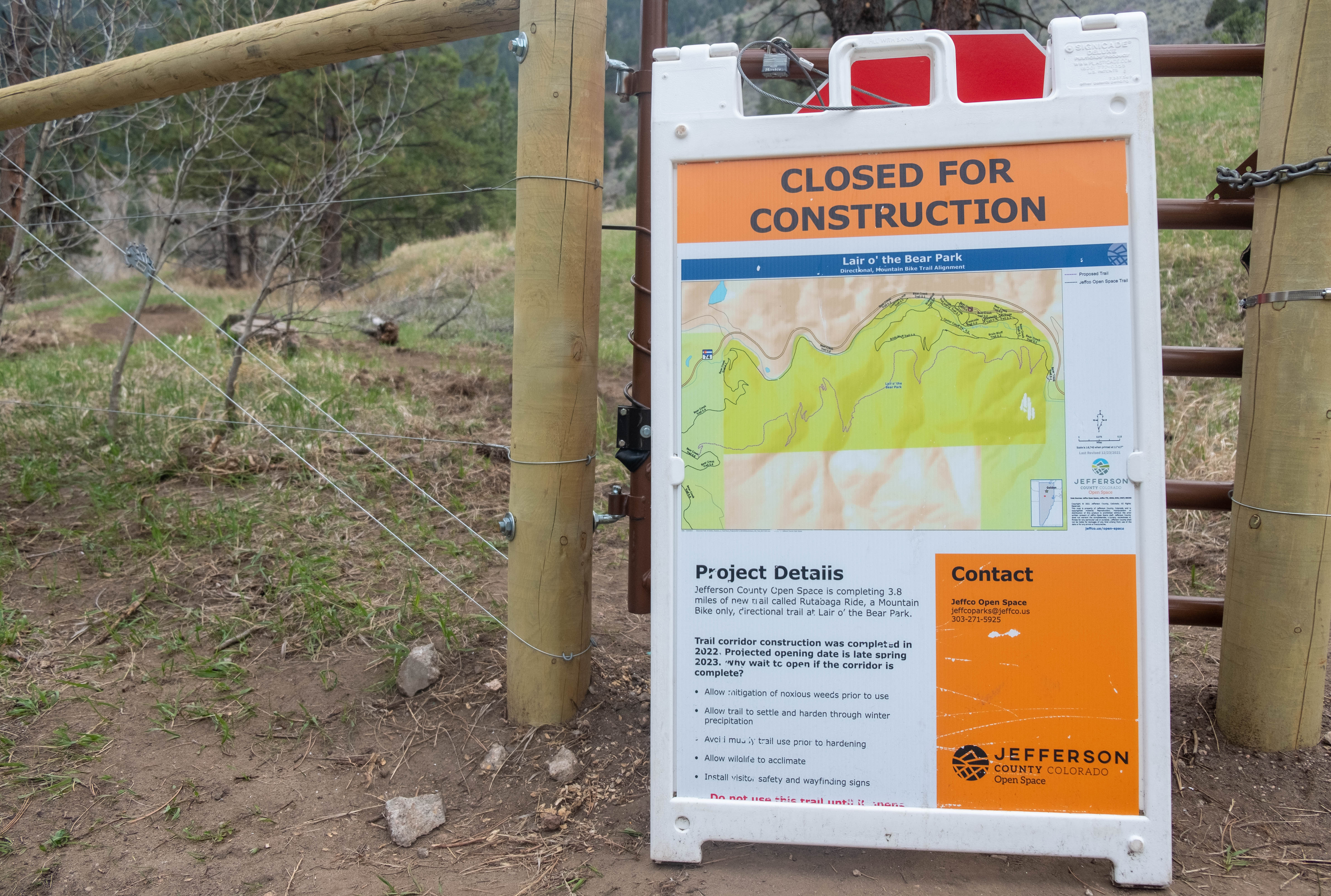 A Jefferson County Open Space sign blocks the exit at the bottom of Rutabaga Ride, a new directional downhill-only mountain bike trail in the Lair o' the Bear Park trail system west of Morrison, Colorado. The trail will debut Thursday, May 25, 2023. (Jonathan Ingraham, Denver Gazette)