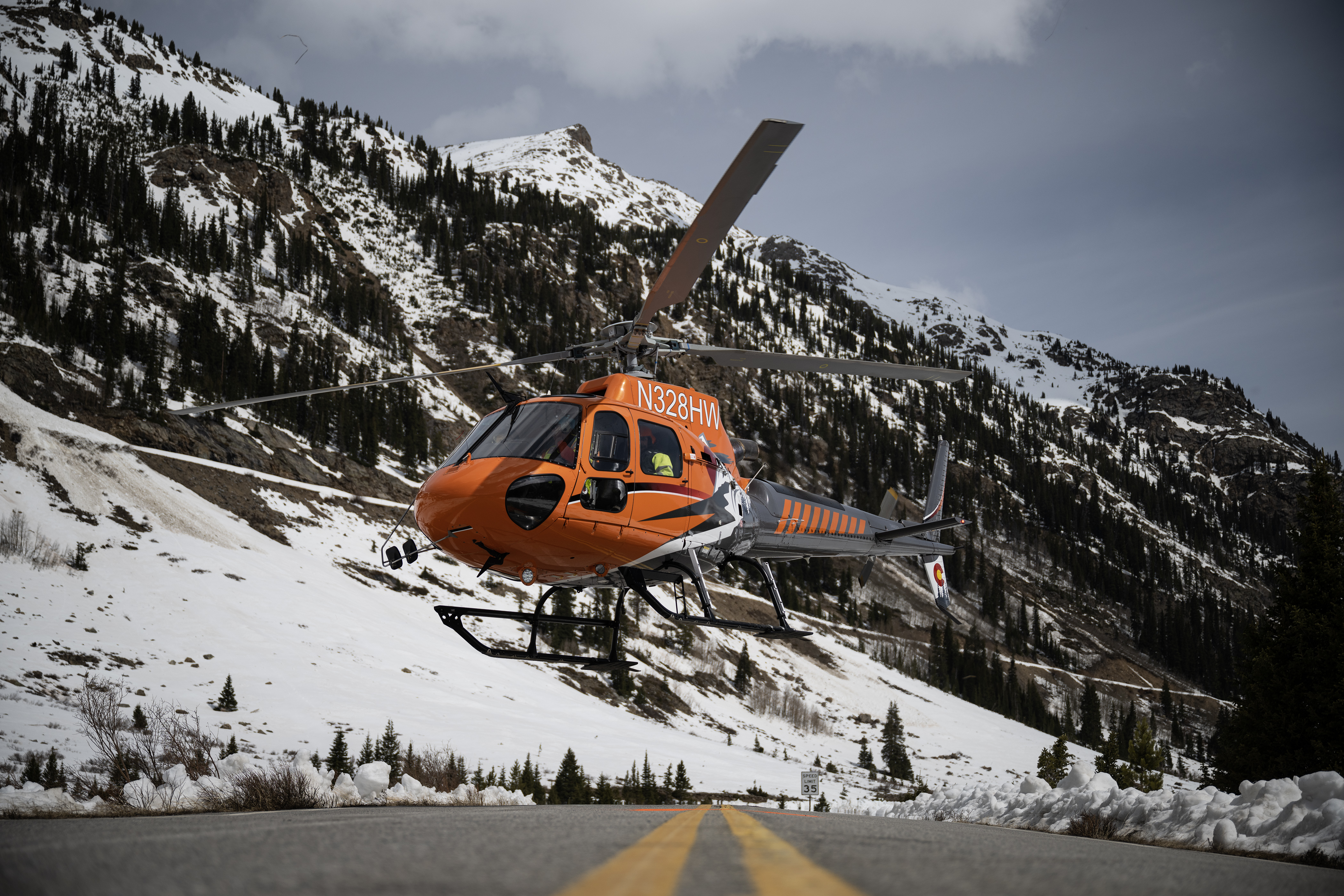 The helicopter being used for avalanche mitigation work takes off from Colorado 82 before it heads to the saddle of the mountain to blast the overhanging snow slab and trigger an avalanche on the east side of Independence Pass on Tuesday, May 2, 2023, in Lake County, Colo. (Timothy Hurst/Denver Gazette) (TimHursttim.hurst@gazette.comhttps://secure.gravatar.com/avatar/aca82bd62b4ee425c598527cd6faa1b1?d=mm&r=g)