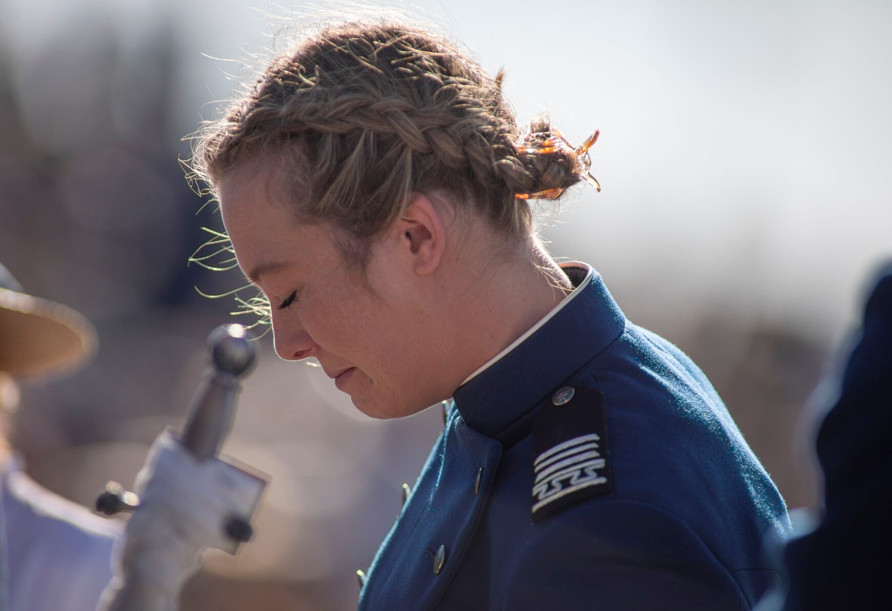 Graduating cadet Haley Brunkal takes a moment after parachuting onto Stillman Field at the U.S. Air Force Academy Class of 2023 Graduation Parade in Colorado Springs, Co., on Wednesday, May 31, 2023. (Gabi Broekema)