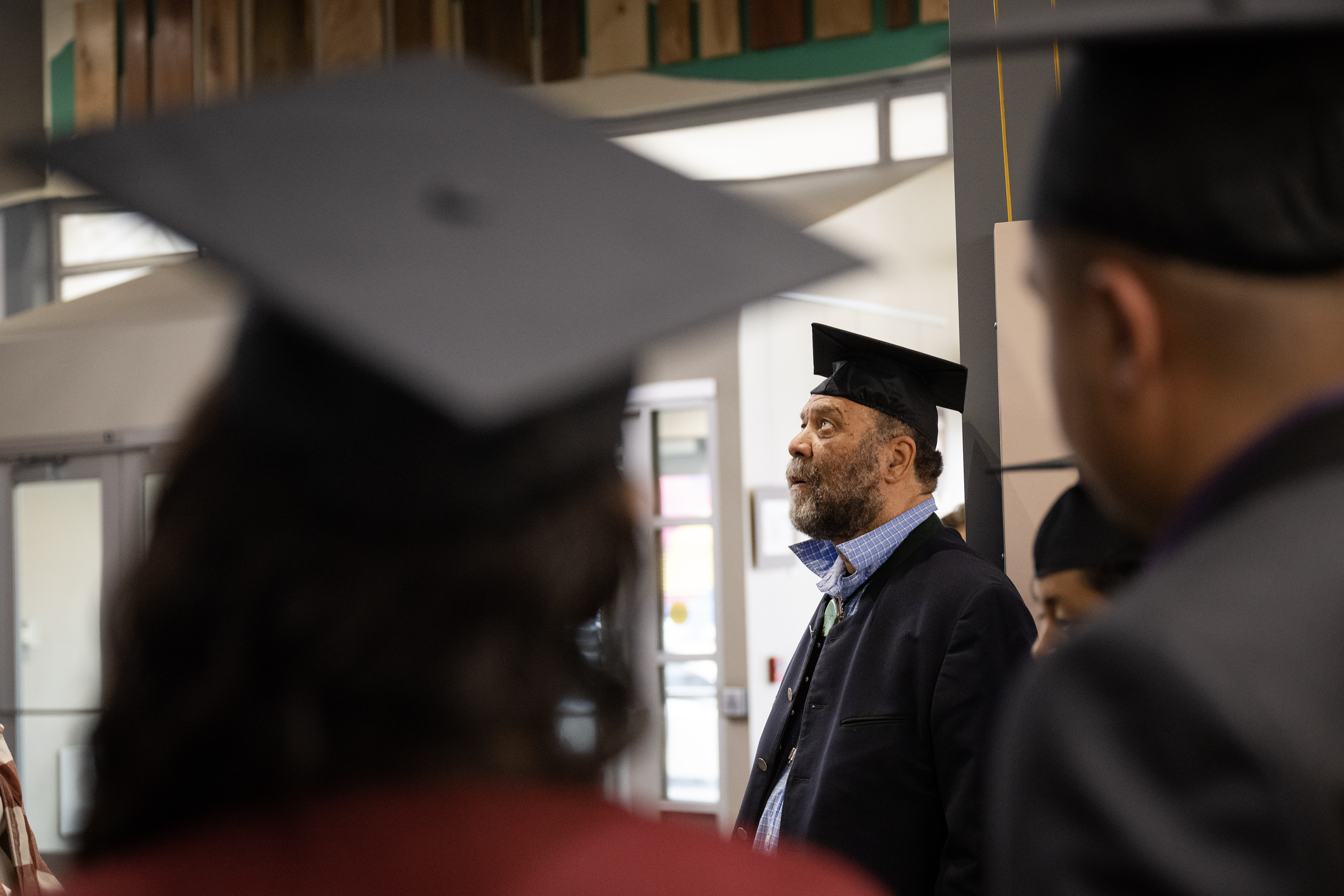 Denver Blues legend Otis Taylor, center, waits with former Manual High School students before a graduation ceremony where the Denver Public Schools board would confer degrees to students who’s education was disrupted by the closing of Manual High School in 2006, as well as confer a degree to Taylor who was expelled 57 years ago for refusing to trim his hair, as seen on Monday, May 15, 2023, during a Denver Public Schools Board of Education meeting in Denver. (Timothy Hurst/Denver Gazette) (TimHursttim.hurst@gazette.comhttps://secure.gravatar.com/avatar/aca82bd62b4ee425c598527cd6faa1b1?d=mm&r=g)