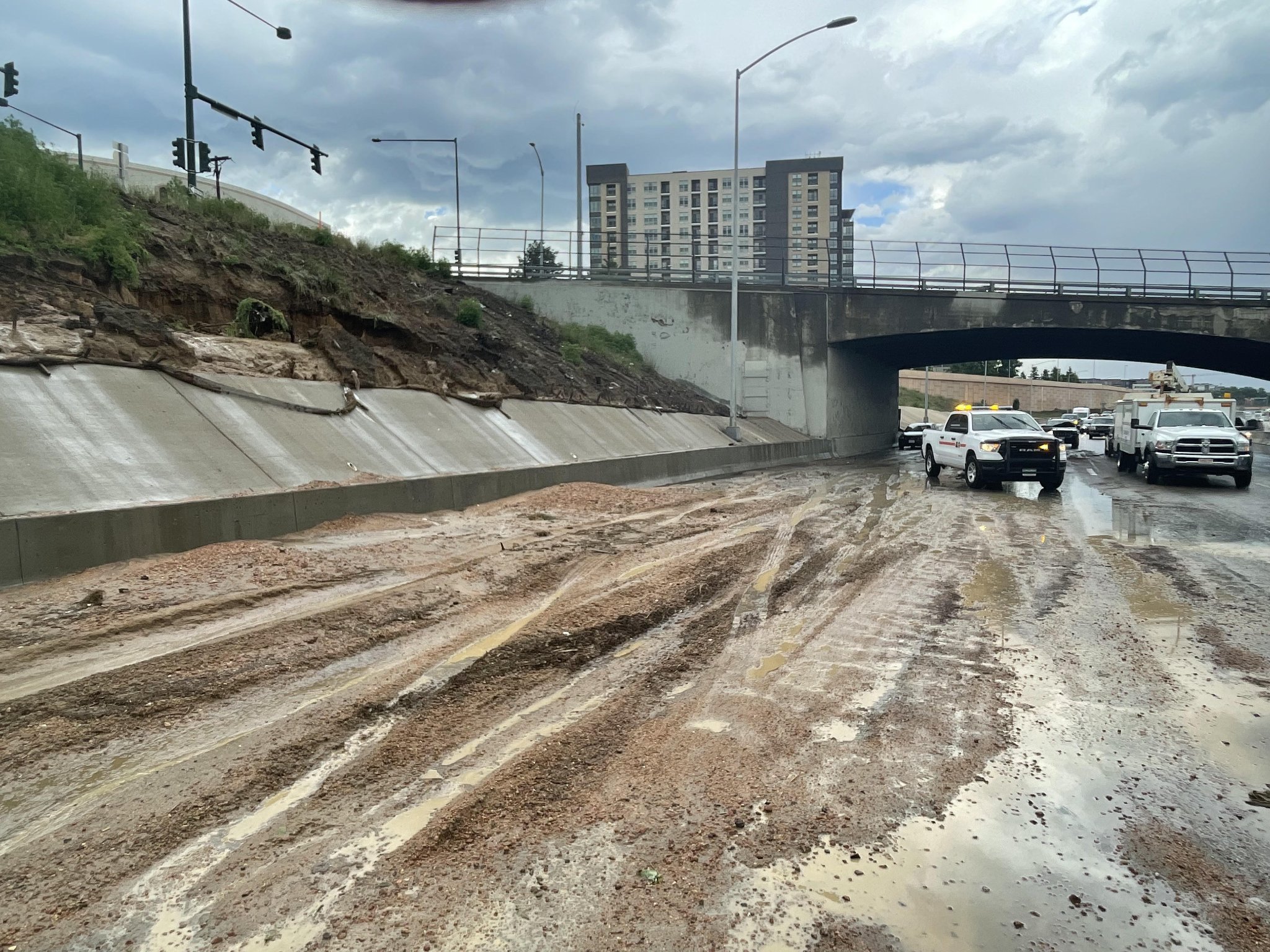 Heavy rain washed dirt and debris onto southbound lanes of Interstate 25 at 23rd Avenue in Denver Thursday. (Colorado Department of Transportation) (Colorado Department of Transportation)