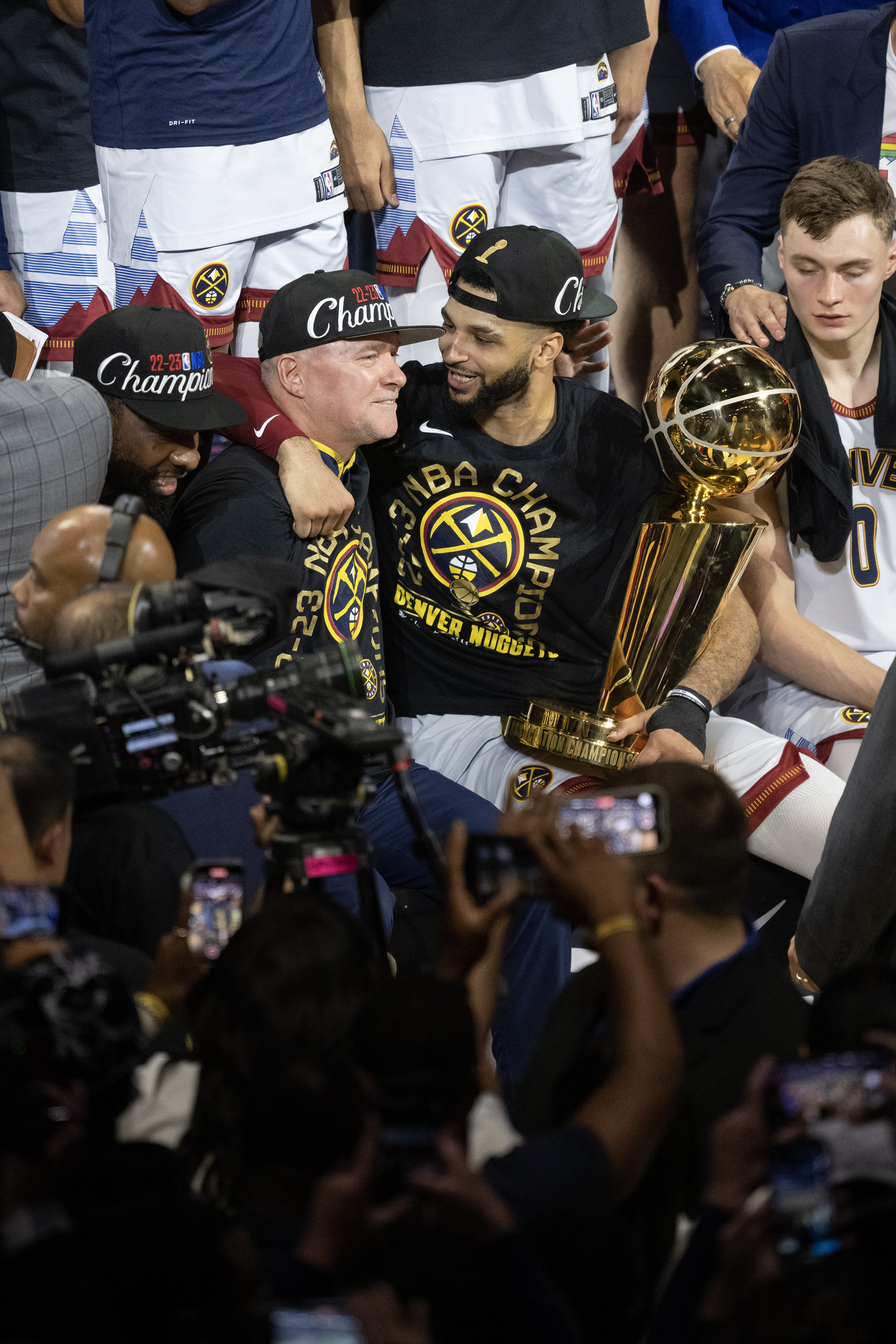 Denver Nuggets guard Jamal Murray (27) and head coach Michael Malone react as Murray holds the Larry O’Brien Championship Trophy after a 94-89 win over the Miami Heat in Game 5 of the NBA Finals on Monday, June 12, 2023, at Ball Arena in Denver. (Timothy Hurst/Denver Gazette) (Timothy Hurst/Denver Gazette)