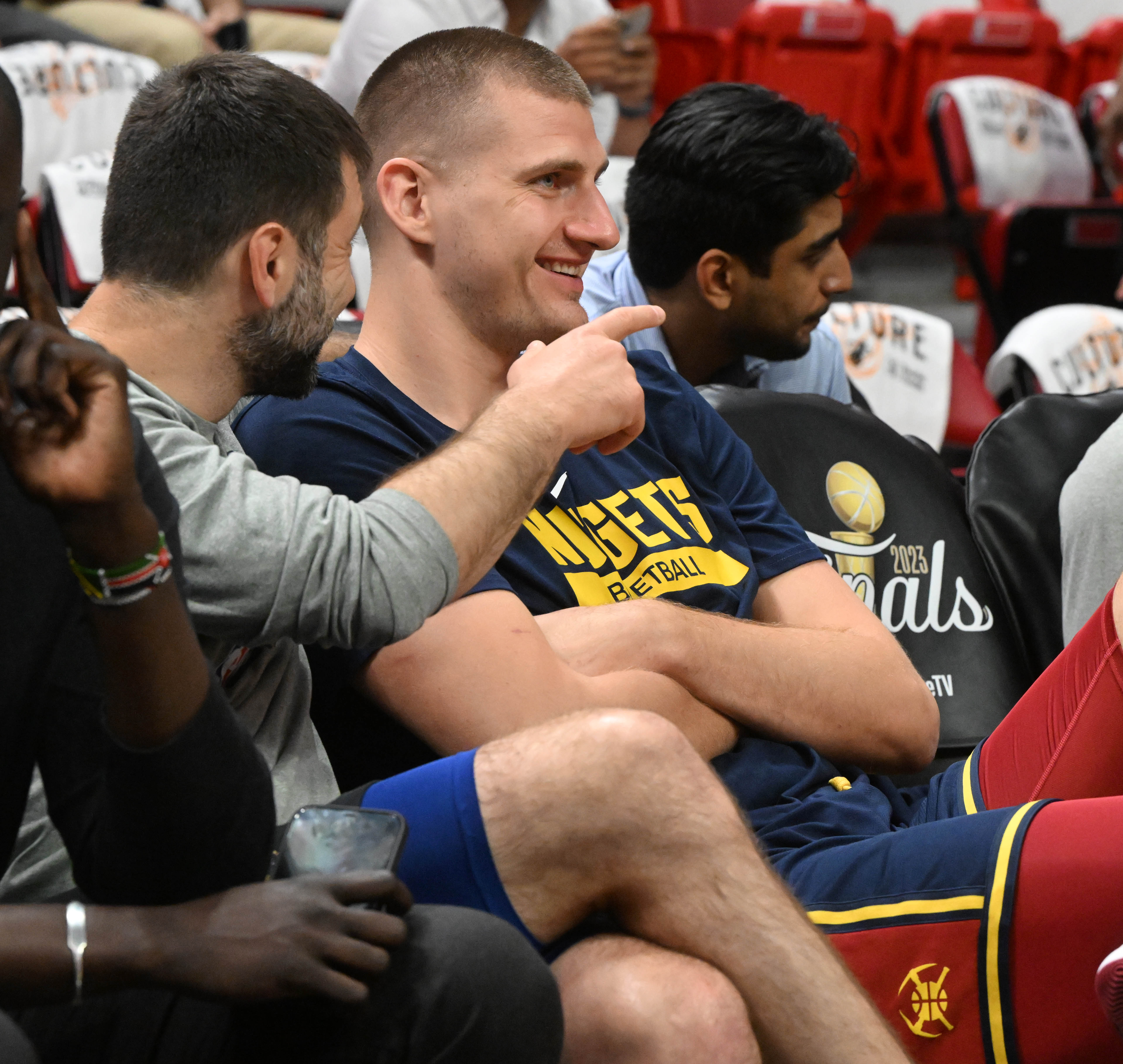 Denver Nuggets center Nikola Jokic (15) jokes around on the bench before warming up at the Kaseya Center in Miami before Game 3 of the NBA Finals on Wednesday, June 7, 2023. (Photo by Jerilee Bennett, The Gazette) (Jerilee Bennett)