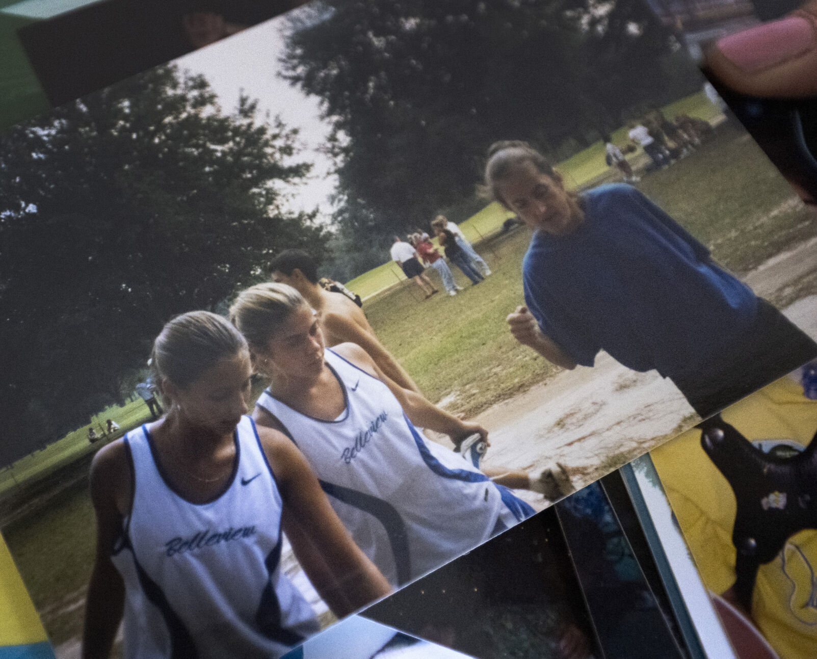 Dreama Walton, center, warms up with her cross-country team her senior year of high school in the fall of 1998. Walton joined the track team the spring before and discovered her love for running. (photos by Christian Murdock The Gazette)