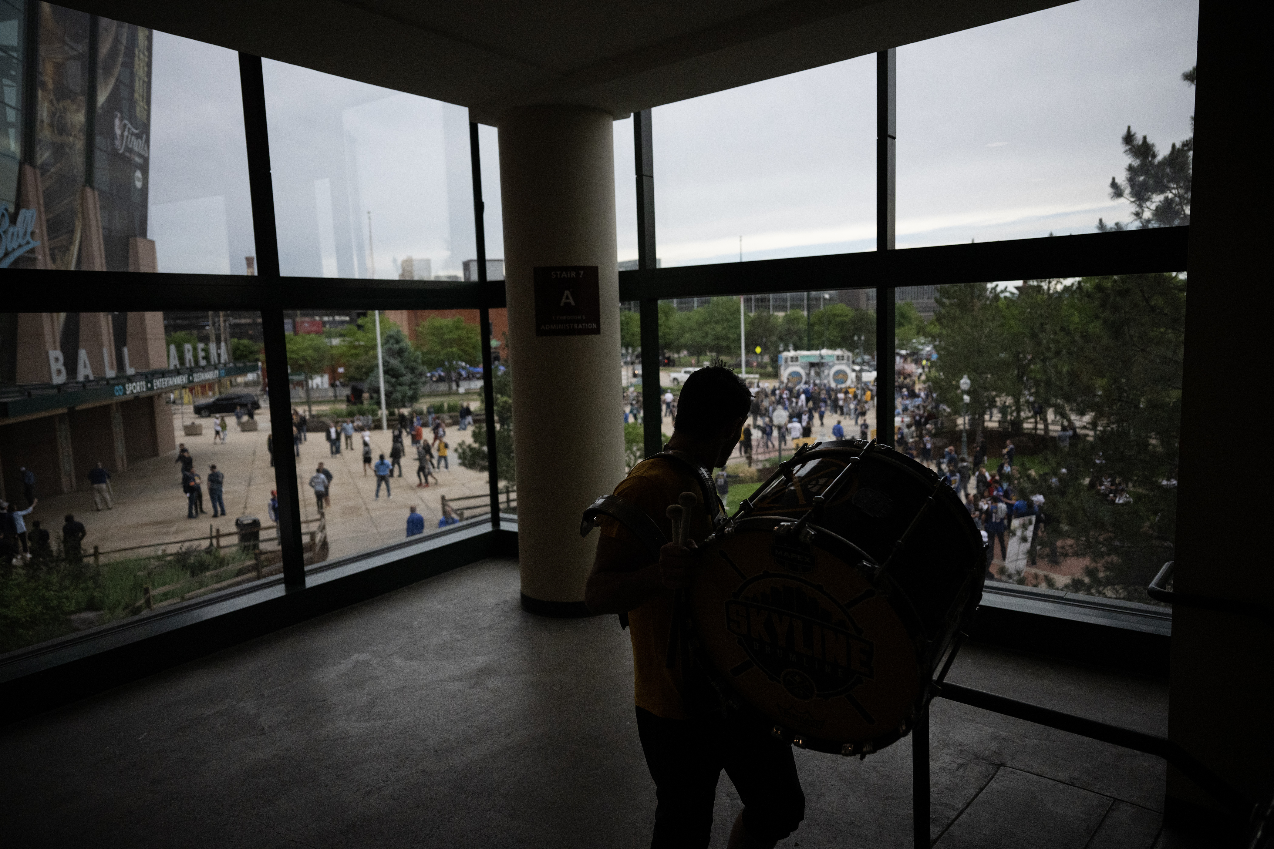 Skyline Drumline drummer Ryan Good heads down the stairs before playing with the drum line to the crowd gathered outside Ball Arena before Game 5 of the NBA Finals between the Denver Nuggets and the Miami Heat on Monday, June 12, 2023, in Denver. (Timothy Hurst/Denver Gazette) (TimHursttim.hurst@gazette.comhttps://secure.gravatar.com/avatar/aca82bd62b4ee425c598527cd6faa1b1?d=mm&r=g)