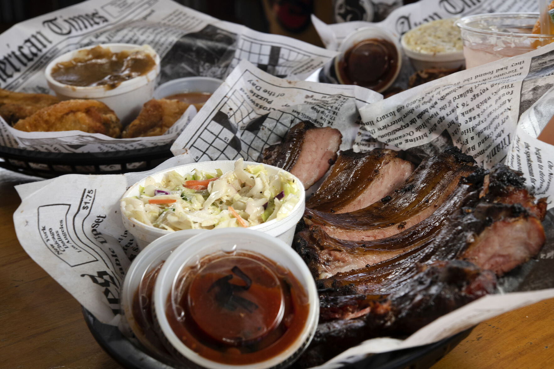 Firehouse on the Run Restaurant (Located at:12480 Black Forest Rd.) “Baby Back Half Rack with Cole Slaw, Broasted Chicken with Mashed Potatoes and Gravy and Pulled Pork and Brat with Western Beans and Potato Salad” Wednesday June 14, 2023. Photo by Jeff Kearney. (Jeff Kearney)