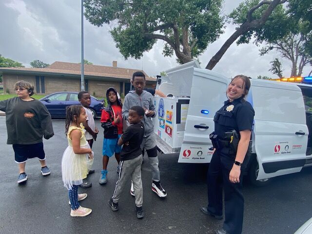 Kids at Aztlan Recreation Center's summer kick-off get a 