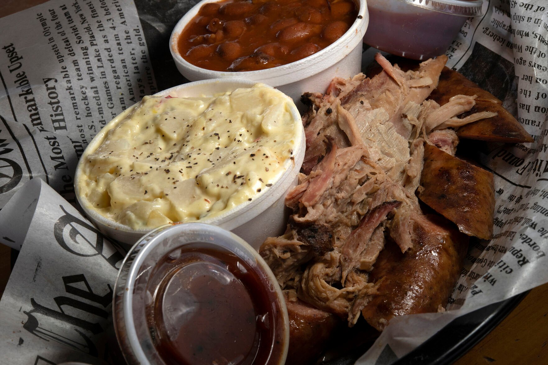 Firehouse on the Run Restaurant (Located at:12480 Black Forest Rd.) “Pulled Pork and Brat with Western Beans and Potato Salad” Wednesday June 14, 2023. Photo by Jeff Kearney. (Jeff Kearney)