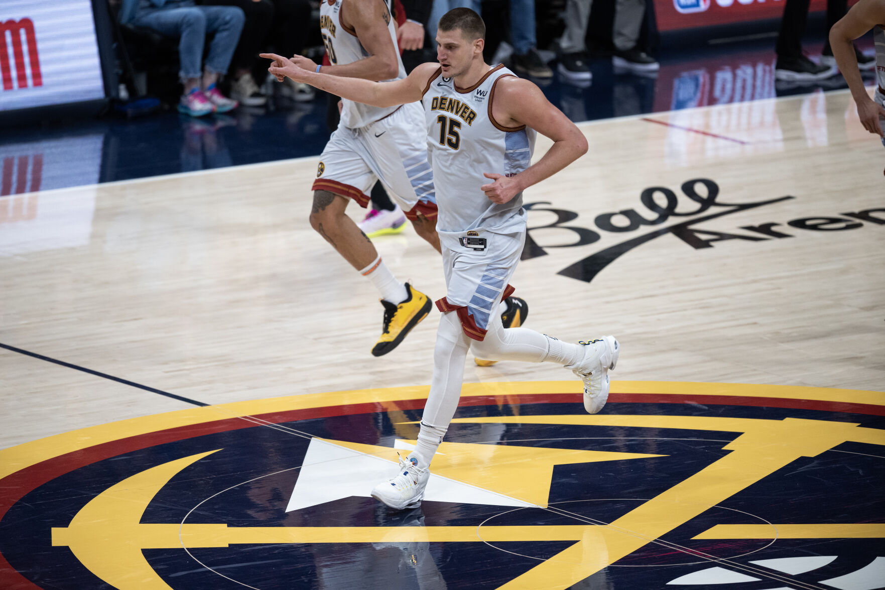 Denver Nuggets center Nikola Jokic (15) points downcourt after hitting layup in a 94-89 win over the Miami Heat in Game 5 of the NBA Finals on Monday, June 12, 2023, at Ball Arena in Denver. (Timothy Hurst/Denver Gazette) (TimHursttim.hurst@gazette.comhttps://secure.gravatar.com/avatar/aca82bd62b4ee425c598527cd6faa1b1?d=mm&r=g)