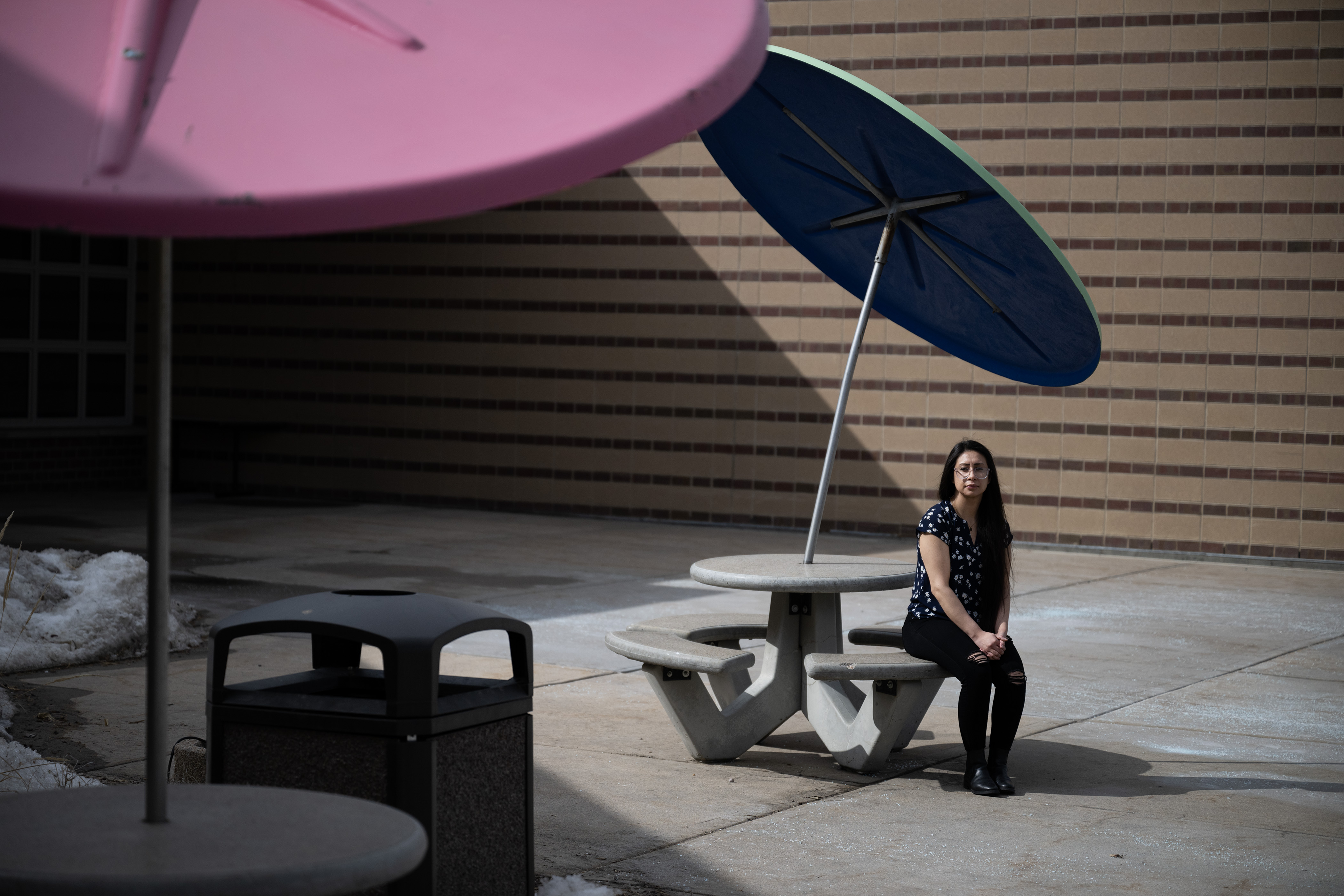 Platte Valley Youth Services youth services specialist Marissa Esquibel sits for a portrait at a table near the front entrance of the facility on Wednesday, March 8, 2023, in Greeley, Colo. (Timothy Hurst/Denver Gazette) (TimHursttim.hurst@gazette.comhttps://secure.gravatar.com/avatar/aca82bd62b4ee425c598527cd6faa1b1?d=mm&r=g)